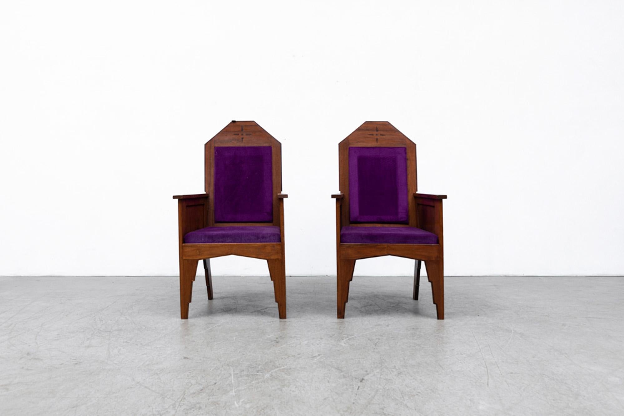 Handsome Pair of Art Deco 'Amsterdam School' arm chairs with purple upholstery. Beautiful Deco detail and design. Frames in original condition with visible wear and patina. Purple Upholstery was added by previous owner, most likely from a church.