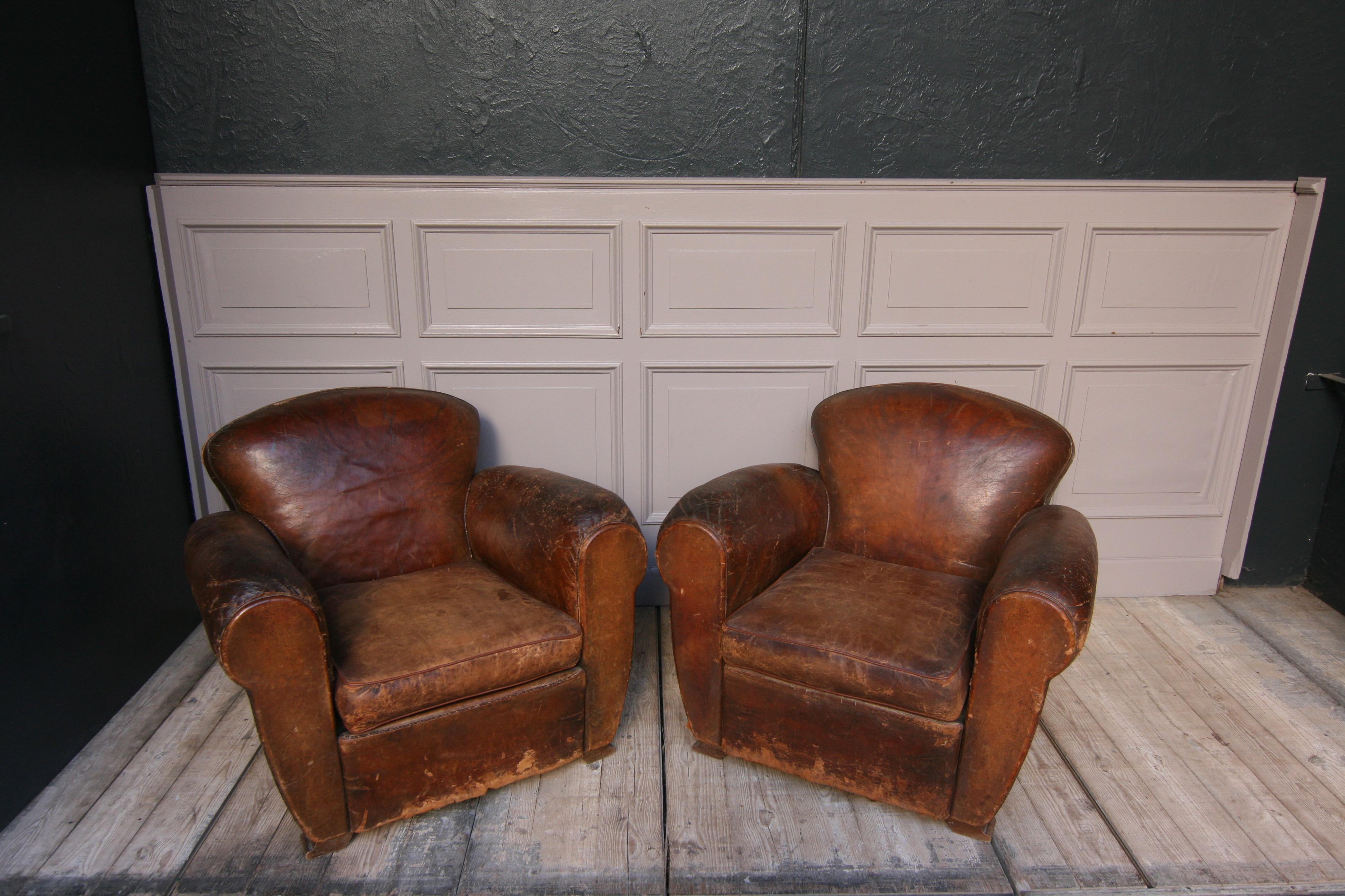 A pair of original Art Deco leather club chairs from the 1920s.
Nice used original vintage look (please see pictures).

Dimensions:
77 cm high / 30.32 inch high,
95 cm wide / 37.4 inch wide,
95 cm deep / 37.4 inch deep;
Seat height 39 cm /