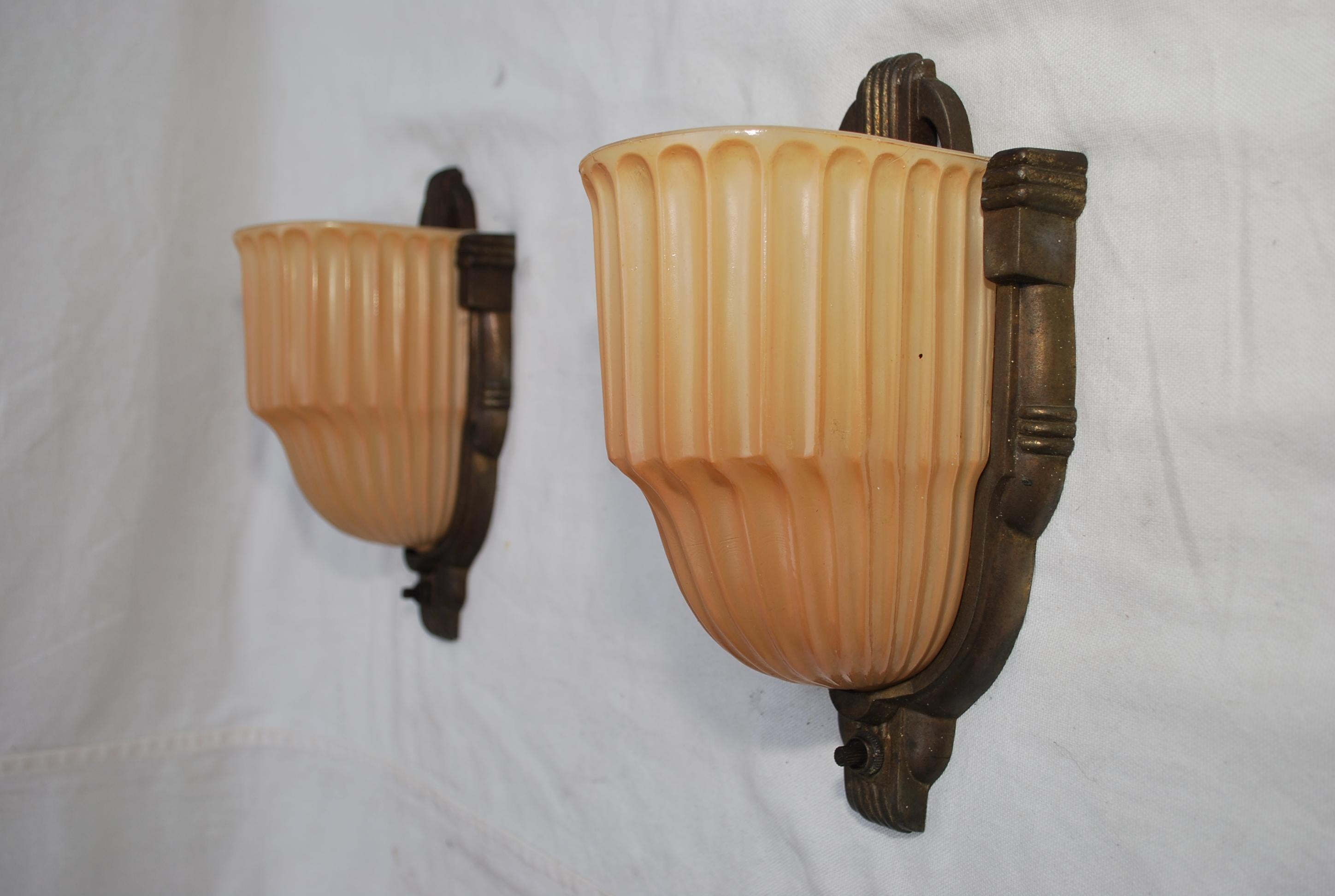A very nice pair of Art deco sconces, the patina is allot nicer in person