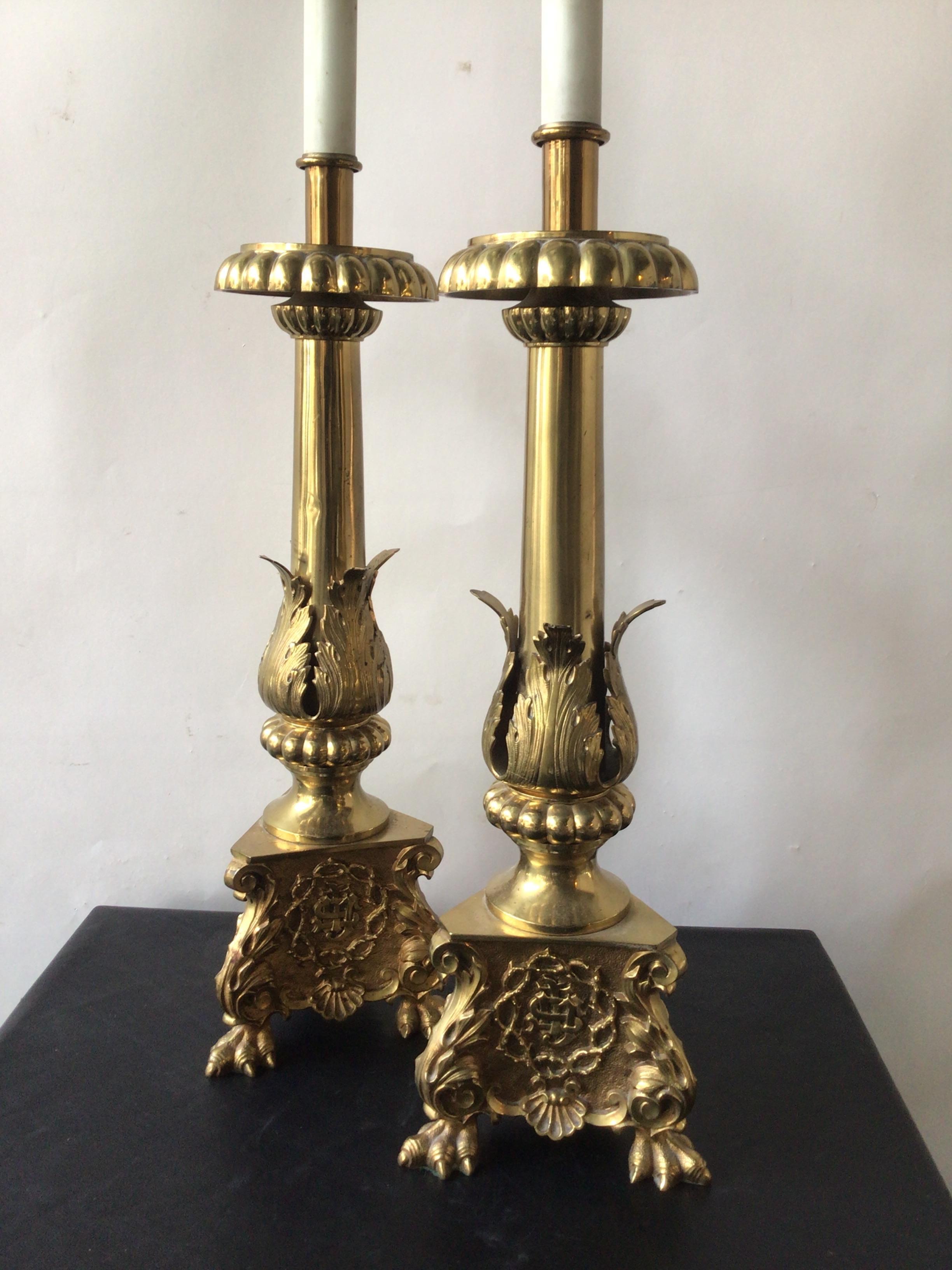 Pair of 1920s brass church candlesticks converted into lamps. Lamps are quite heavy.