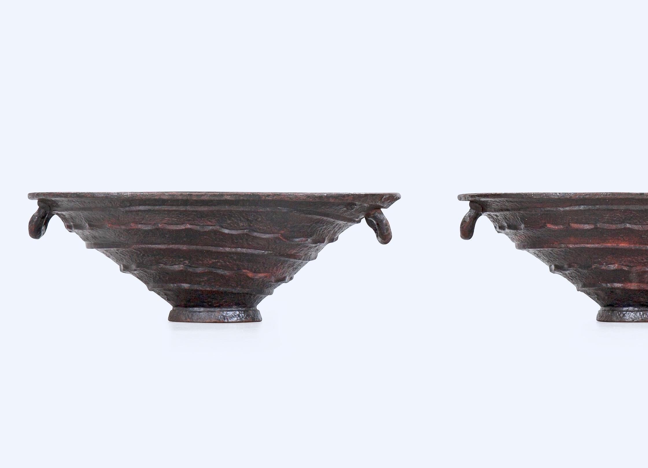 A pair of cast iron urns made by Näfveqvarns bruk (foundry) after a design by Olof Hult (1892-1962) This model was exhibited in the World fair in Paris 1925.
     