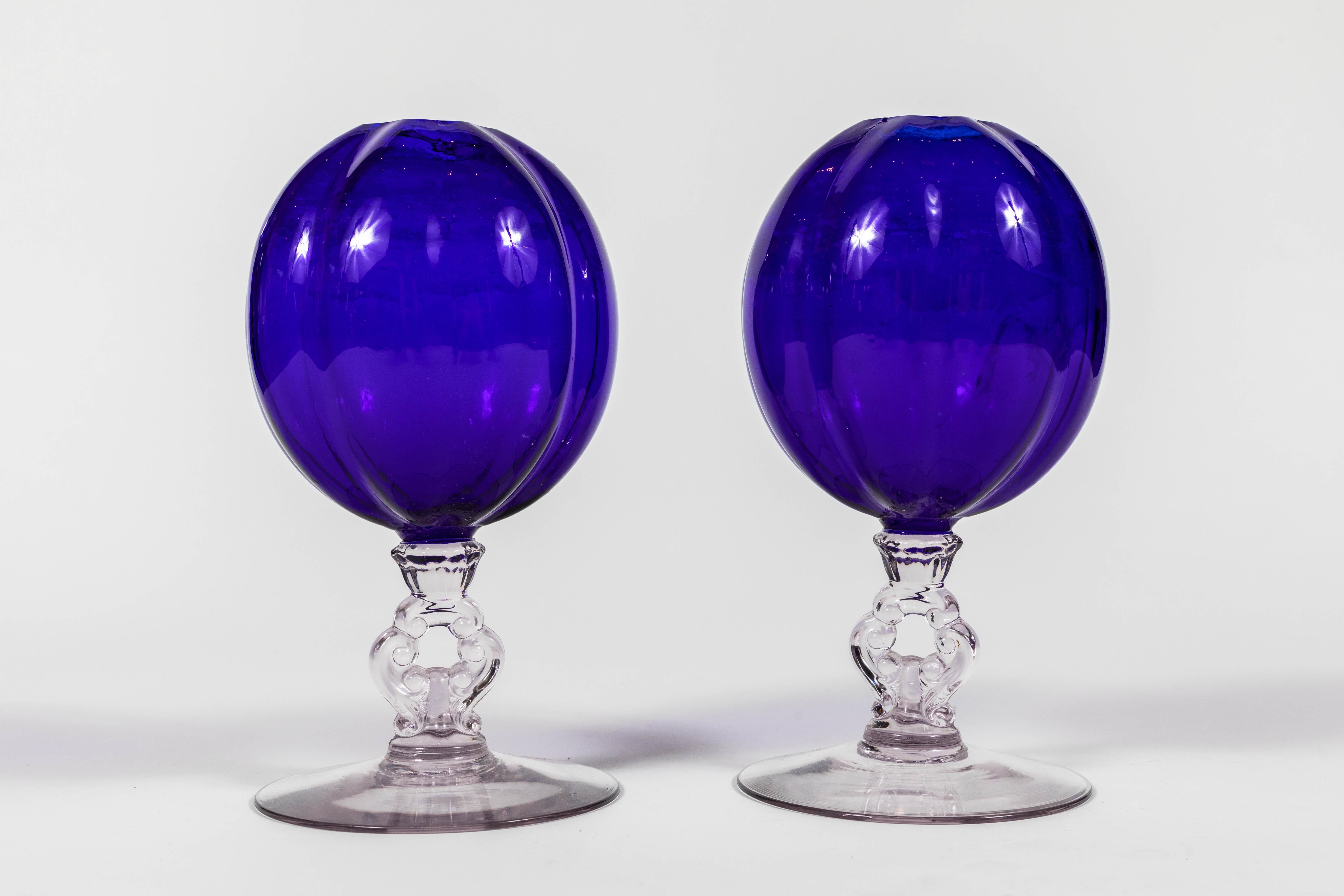 Pair of 1920s cobalt blue glass vases with clear glass stem and foot.