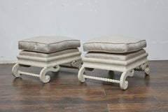 Pair of 1920s Continental Upholstered Ottomans with Carved S-Scroll Bases