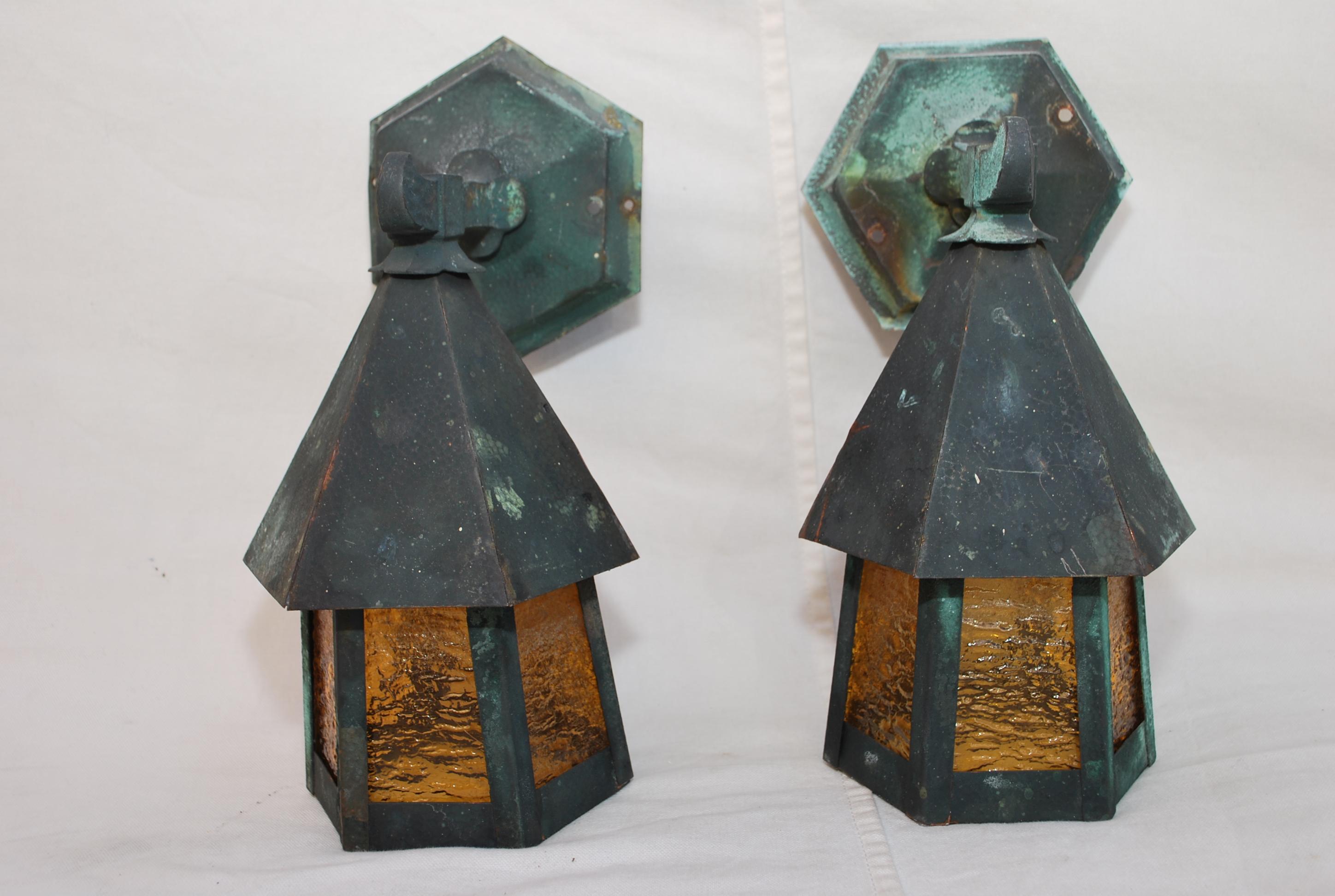 A very nice pair of 1920's copper outdoor sconces, the patina is much nicer in person, ONE OF THE PANEL HAS BEEN REPLACE, YOU DON'T SEE IT BECAUSE IT IS IN THE BACK