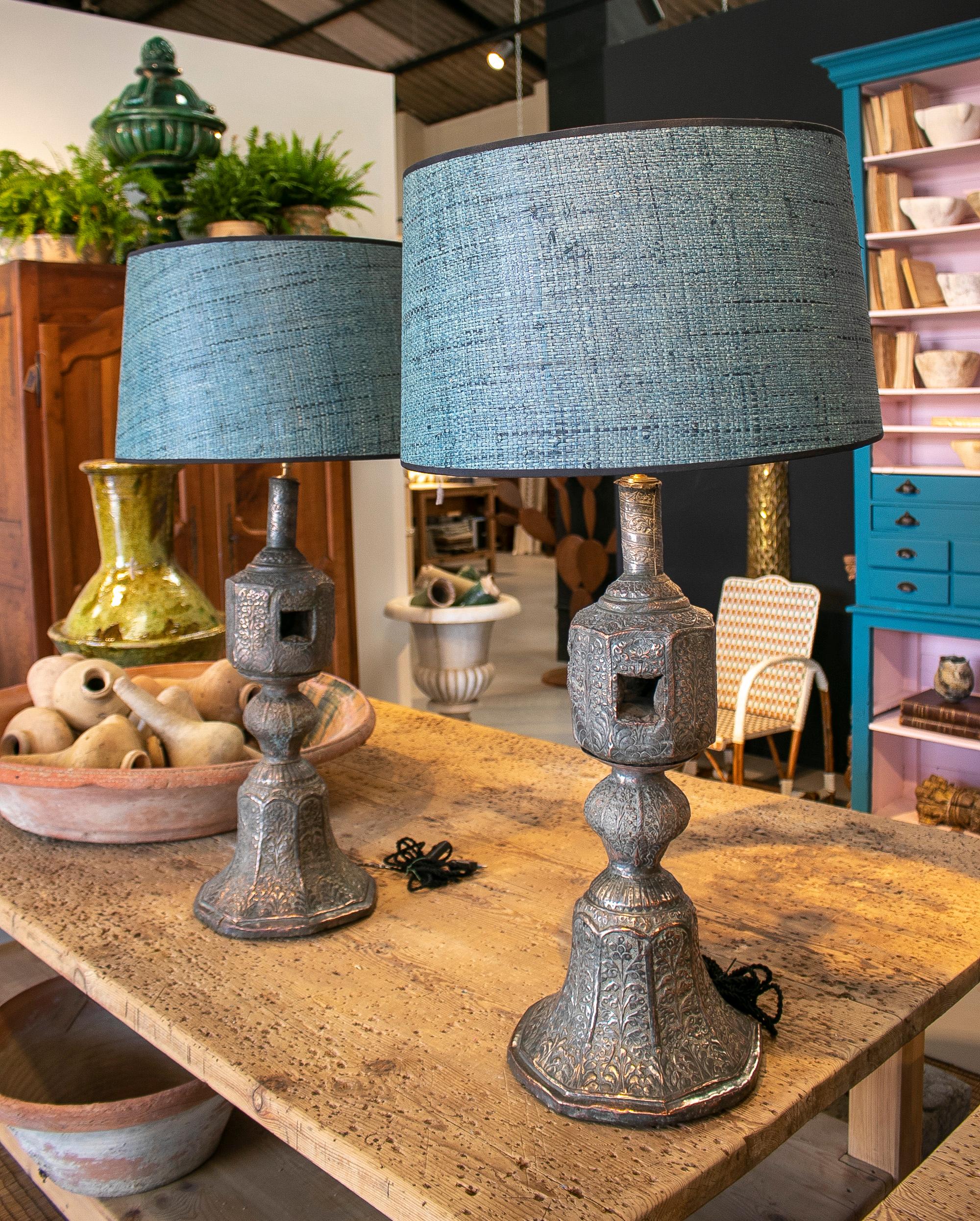 Pair of 1920s Indian silvered metal bed legs turned table lamps. 

Lampshades not included in price. 
 
Dimensions without lampshades: 76 x 30 x 30cm
Dimensions with lampshades: 97 x 50cm.