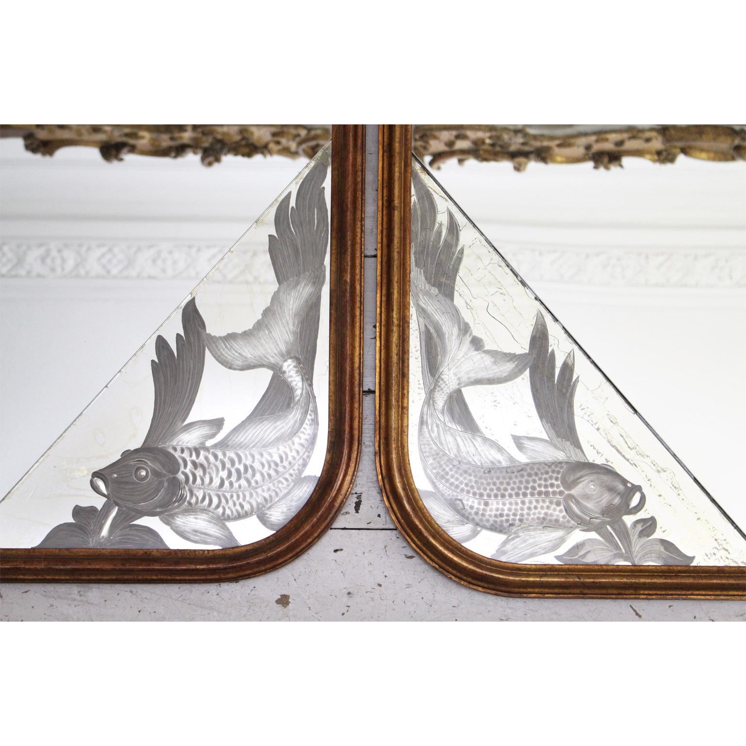 These lovely, decorative mirrors are ornately etched with fish - we have never seen anything quite like them. They were found in a wonderful house in Tuscany. The frames, are gilt with rounded corners. Although a pair, they slightly differ in size