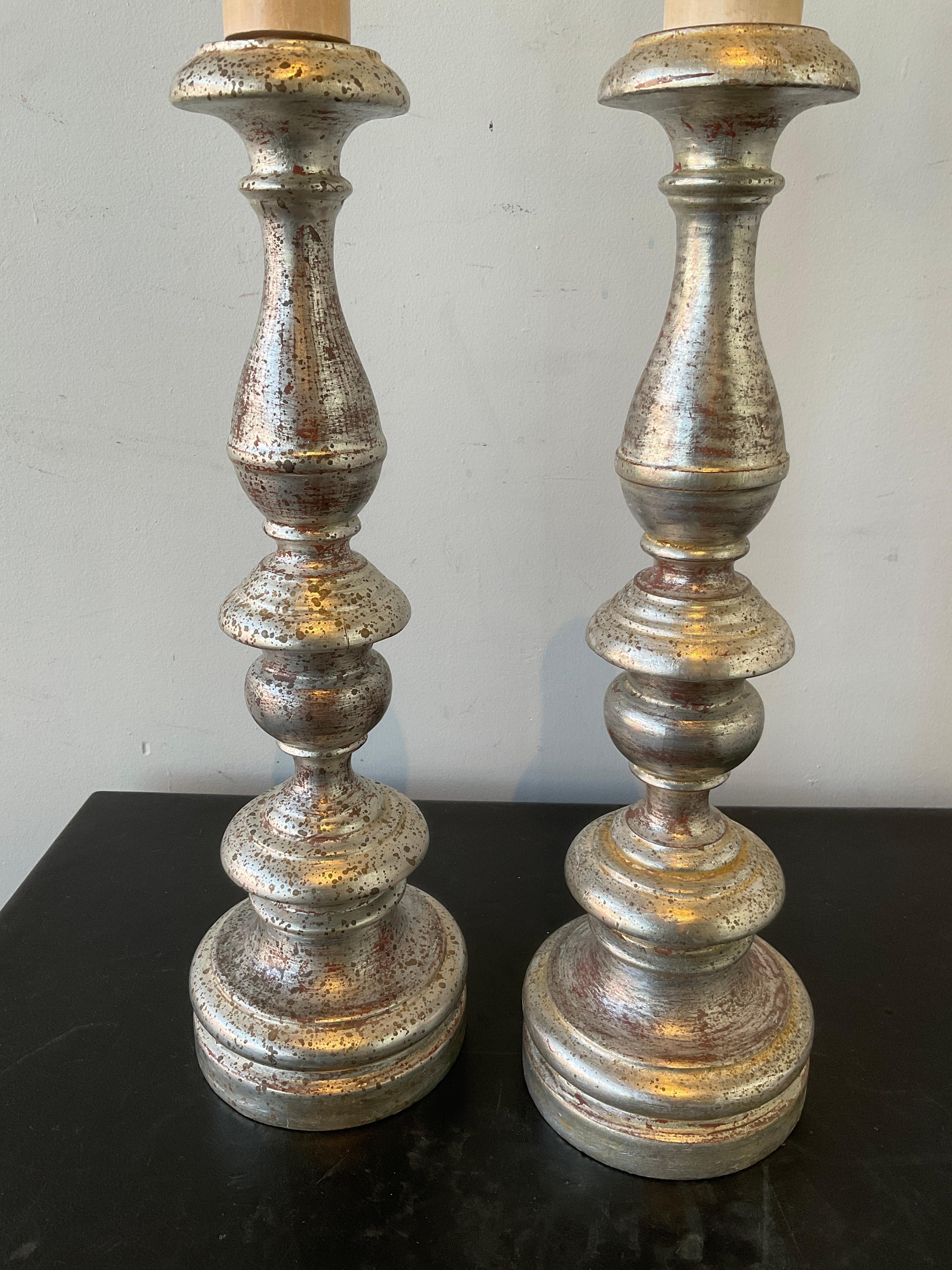 Pair of 1920s Italian silver leaf wood candlestick lamps.