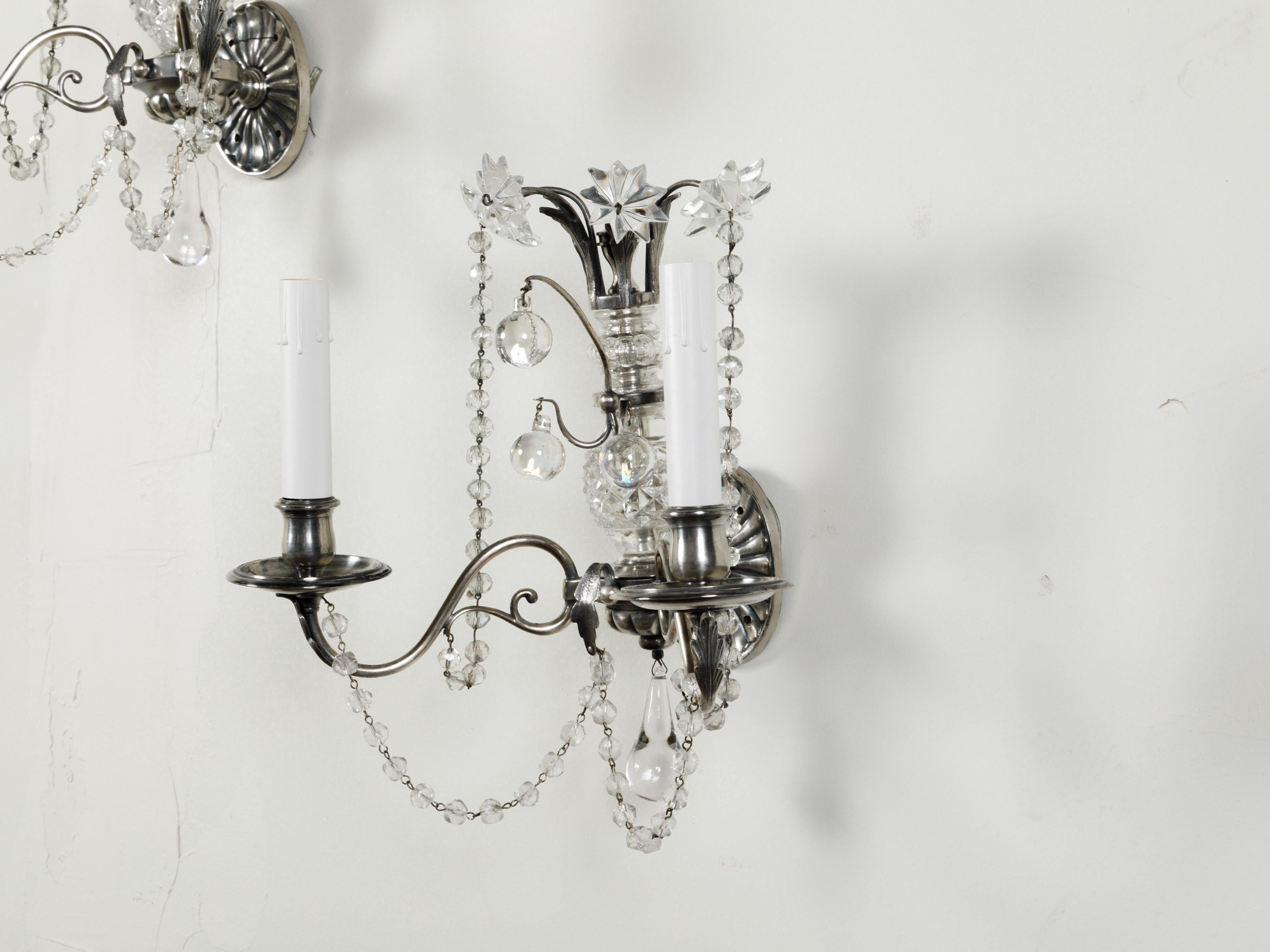 Pair of 1920s Metal and Crystal Two-Arm Wall Sconces with Beads and Rosettes For Sale 1