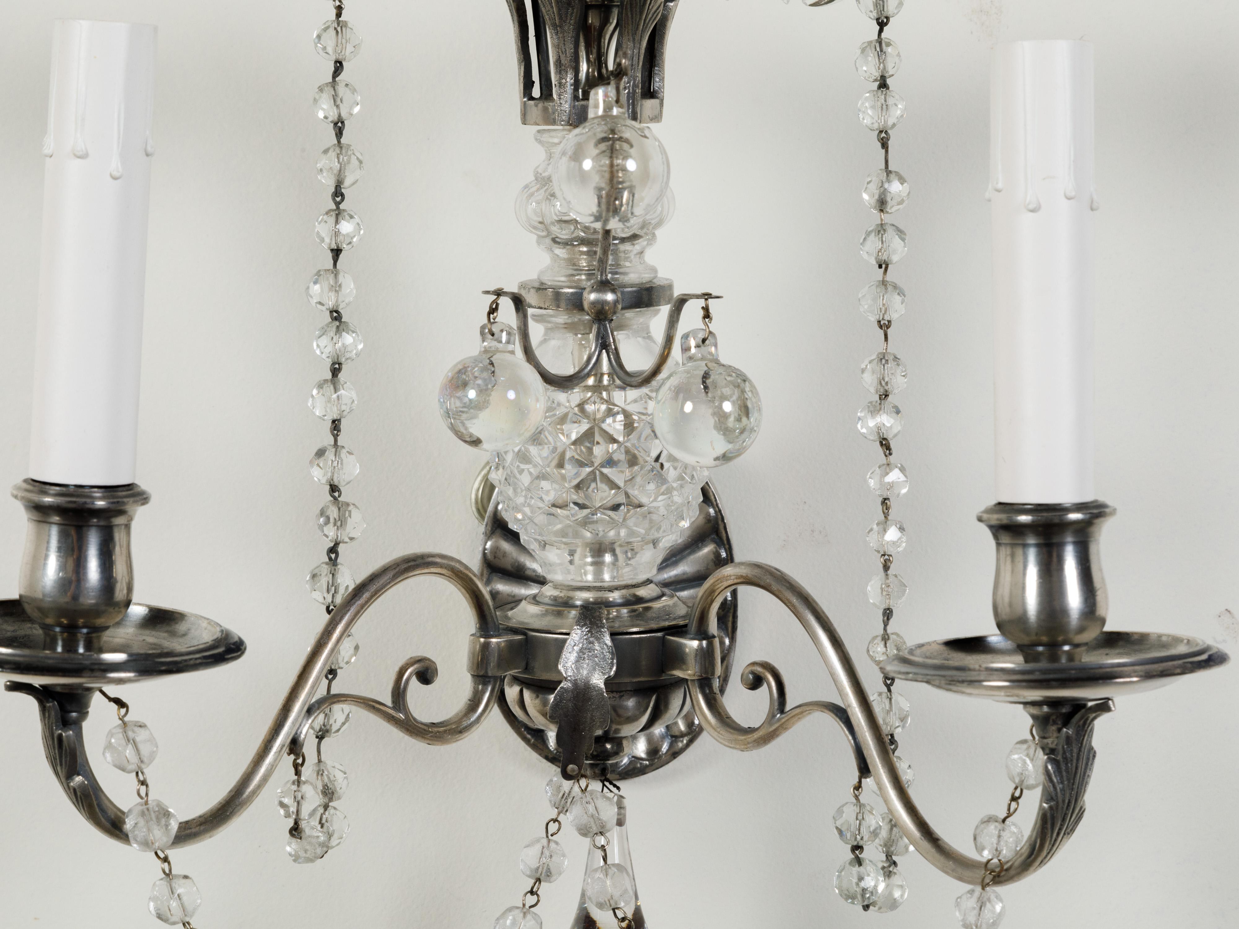 Pair of 1920s Metal and Crystal Two-Arm Wall Sconces with Beads and Rosettes For Sale 3