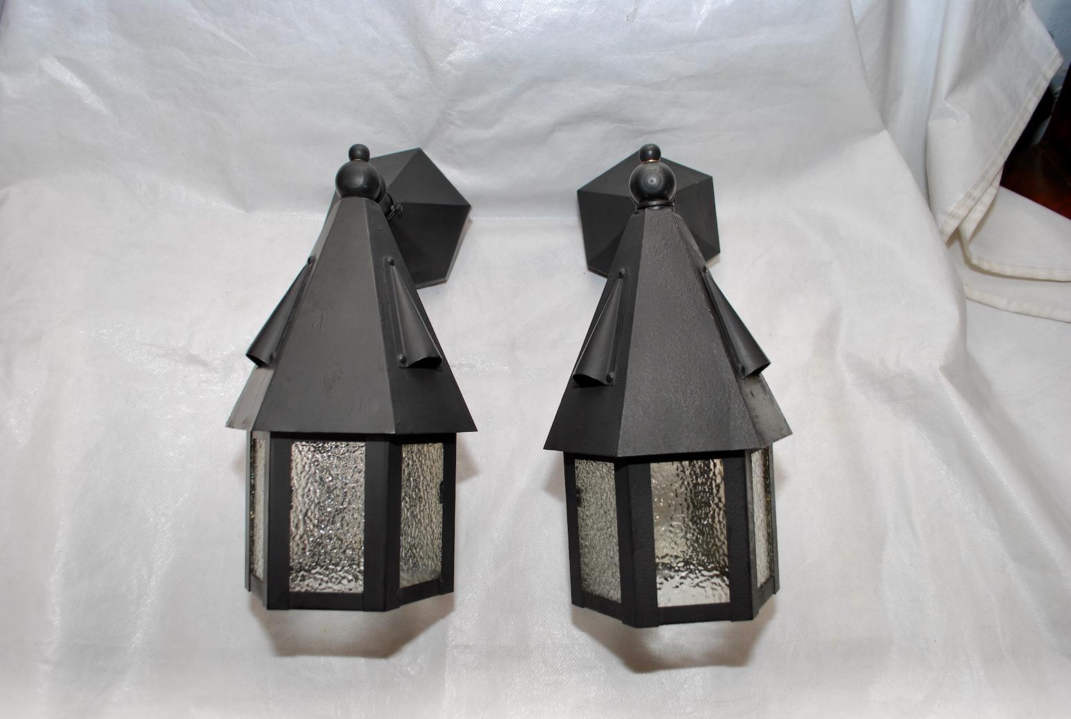 A nice pair of 1920's outdoor sconces, they have been restored and painted.