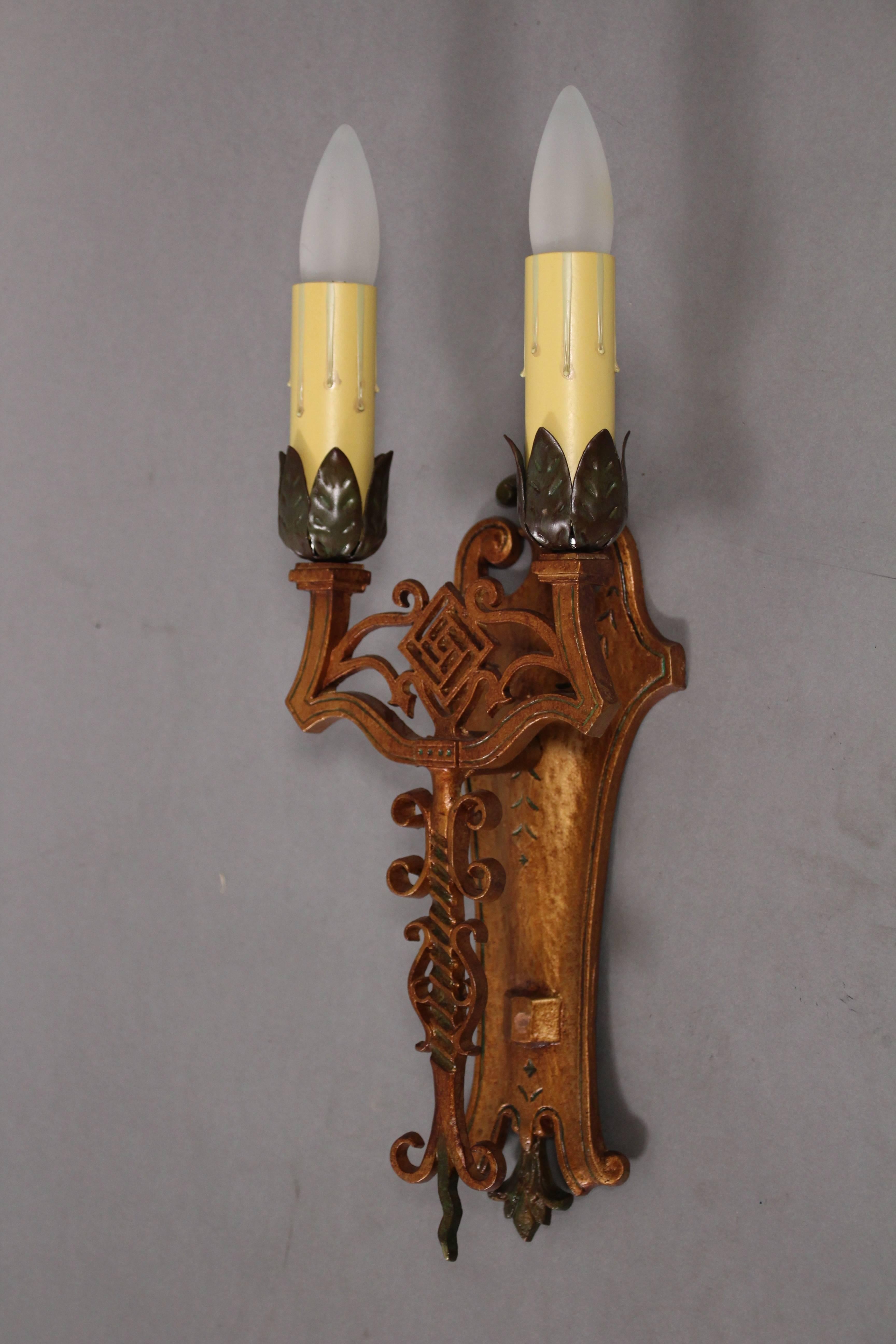 Pair of 1920s sconces with original polychrome finish. Fits nicely in Spanish Revival, English Tudor and Gothic style homes.