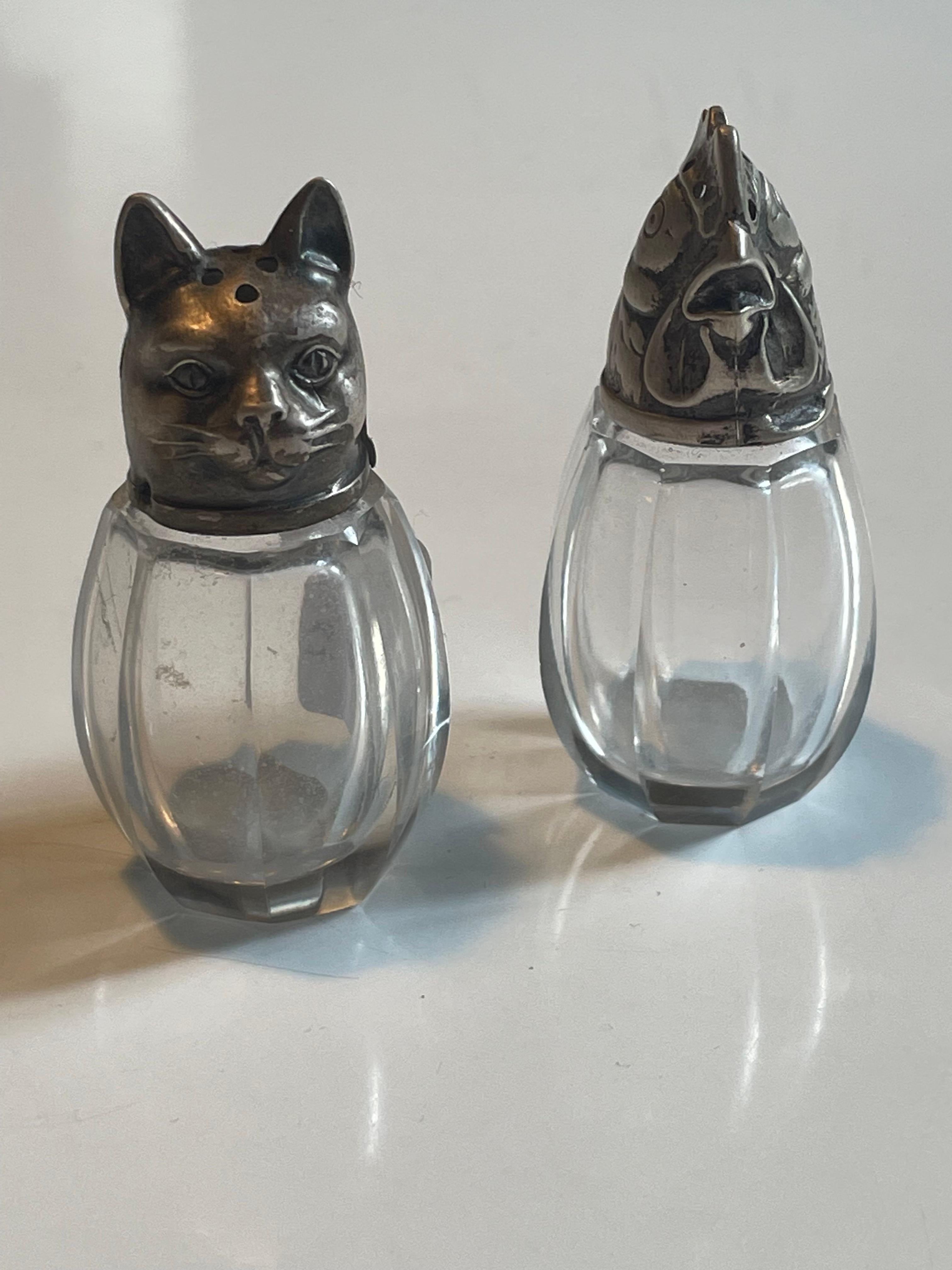 Exquisite pair of salt and pepper shakers made of silver and crystal in 1920s France. Excellent quality craftsmanship, these little animal heads have been expertly made and are not only beautiful but rare to find.