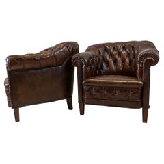 Pair of 1920s Swedish Deep Buttoned Chesterfield Style Leather Armchairs