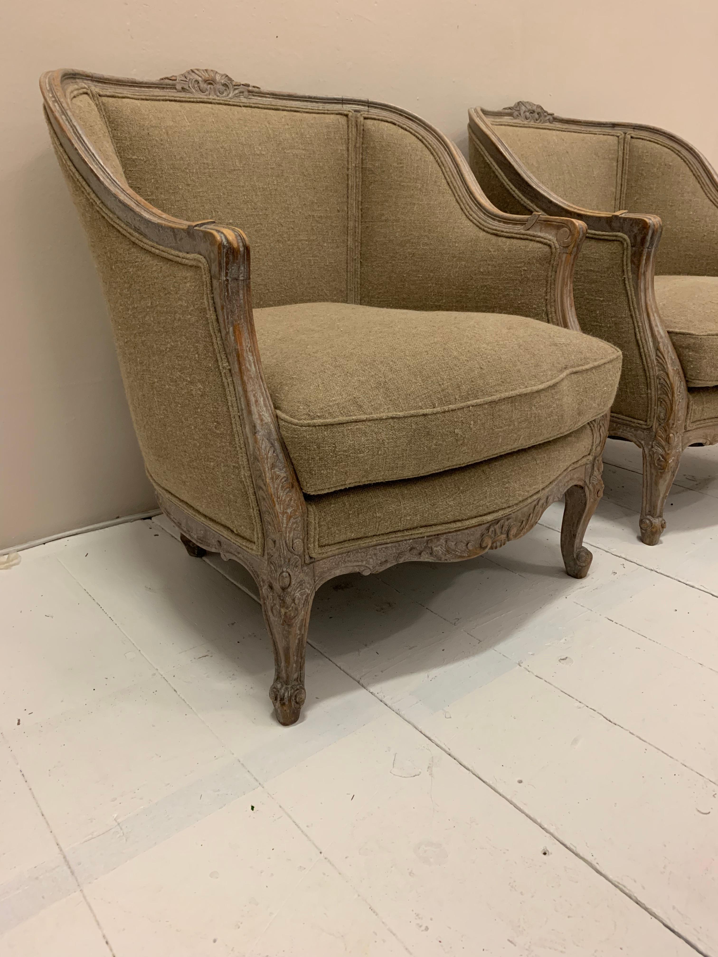 A pair of lovely Swedish armchairs circa 1920s designed in the French manner.
The wood surround has decorative detailing with a light wash which shows some traces of the original paint.
The armchairs are comfortable and of a decent size with deep