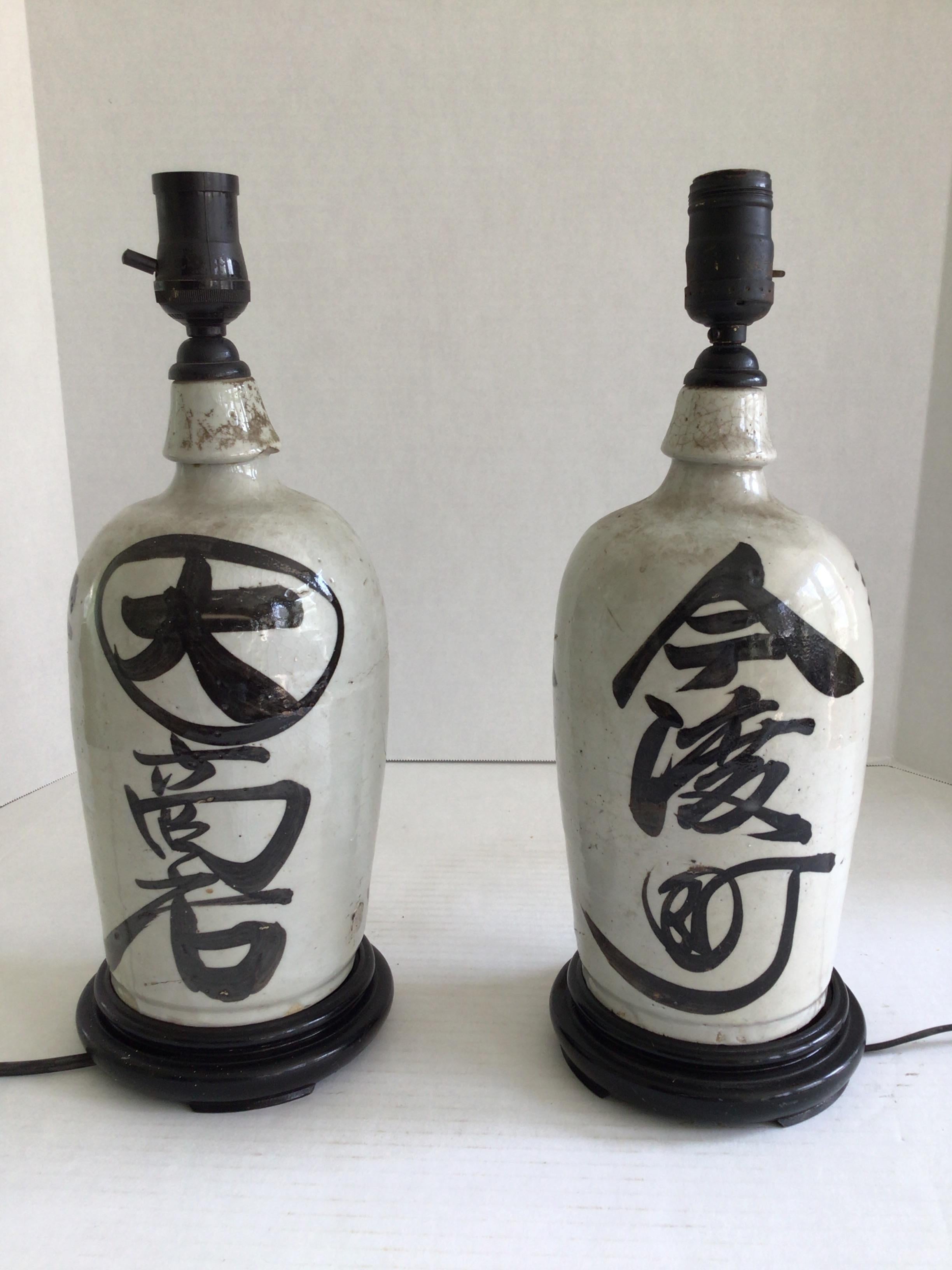 Pair of 1920s Table Lamps Chinese Glazed Terracotta Painted Jugs on Wood Base
Sake Jugs - Japanese 
Height to top of socket: 15.5