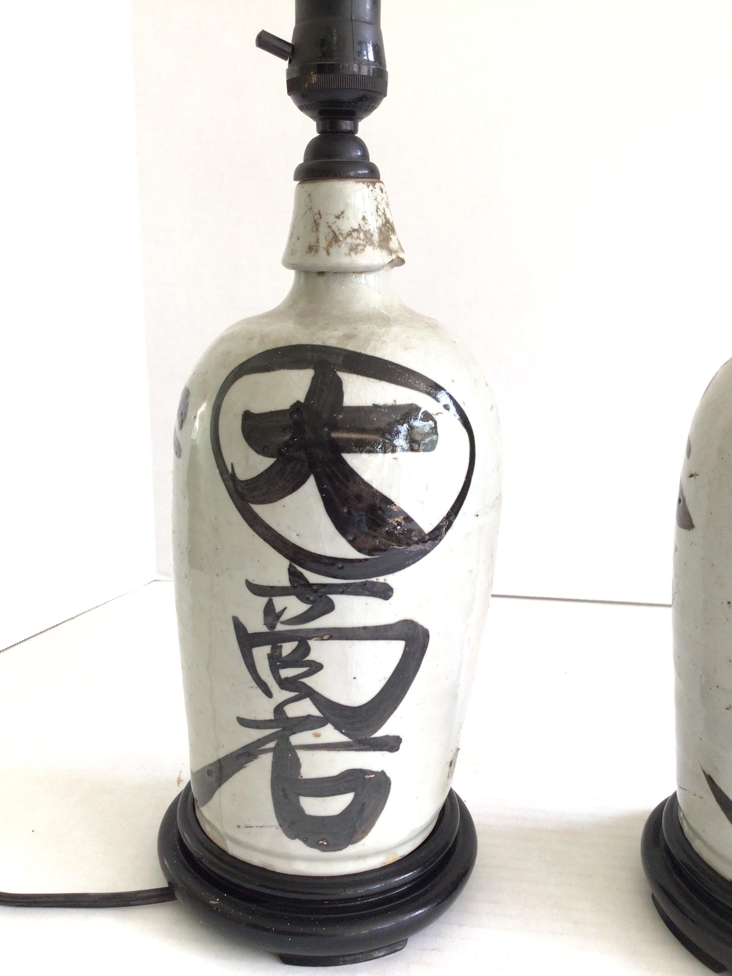 Glazed Pair of 1920s Table Lamps Made From Sake Jugs on Wood Base For Sale
