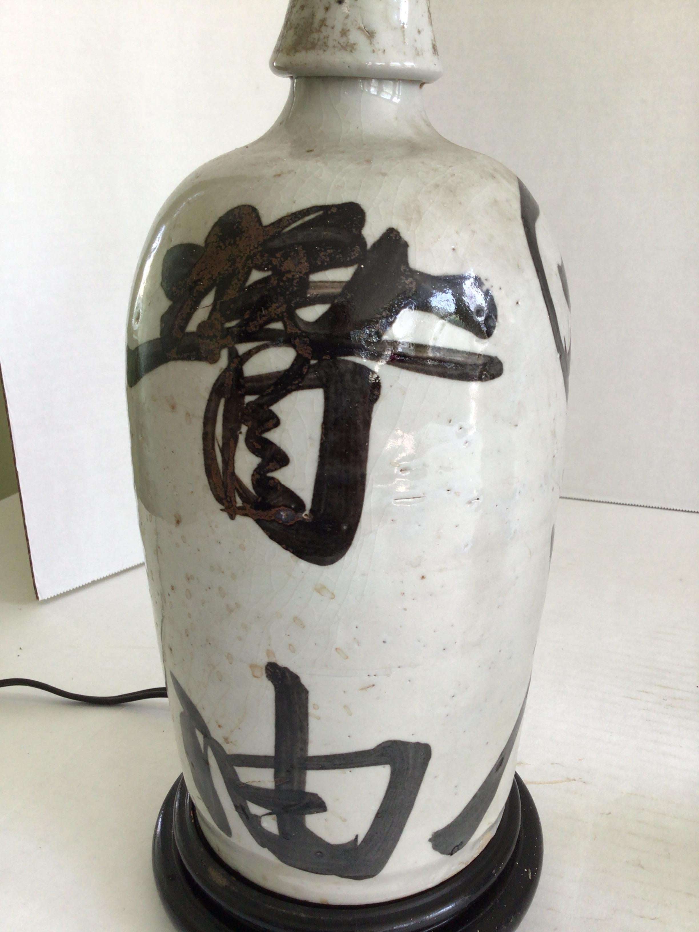 Early 20th Century Pair of 1920s Table Lamps Made From Sake Jugs on Wood Base For Sale