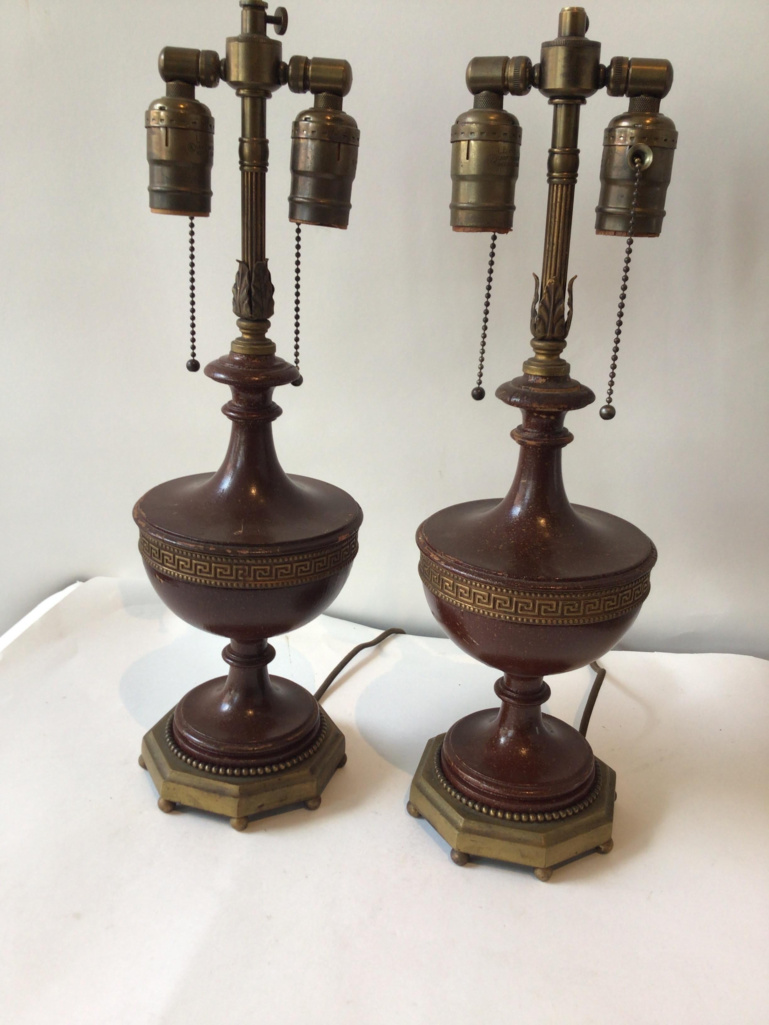 Pair of 1920s wood lamps with brass Greek key ring. Painted finish. Some finish is missing as shown in pictures.