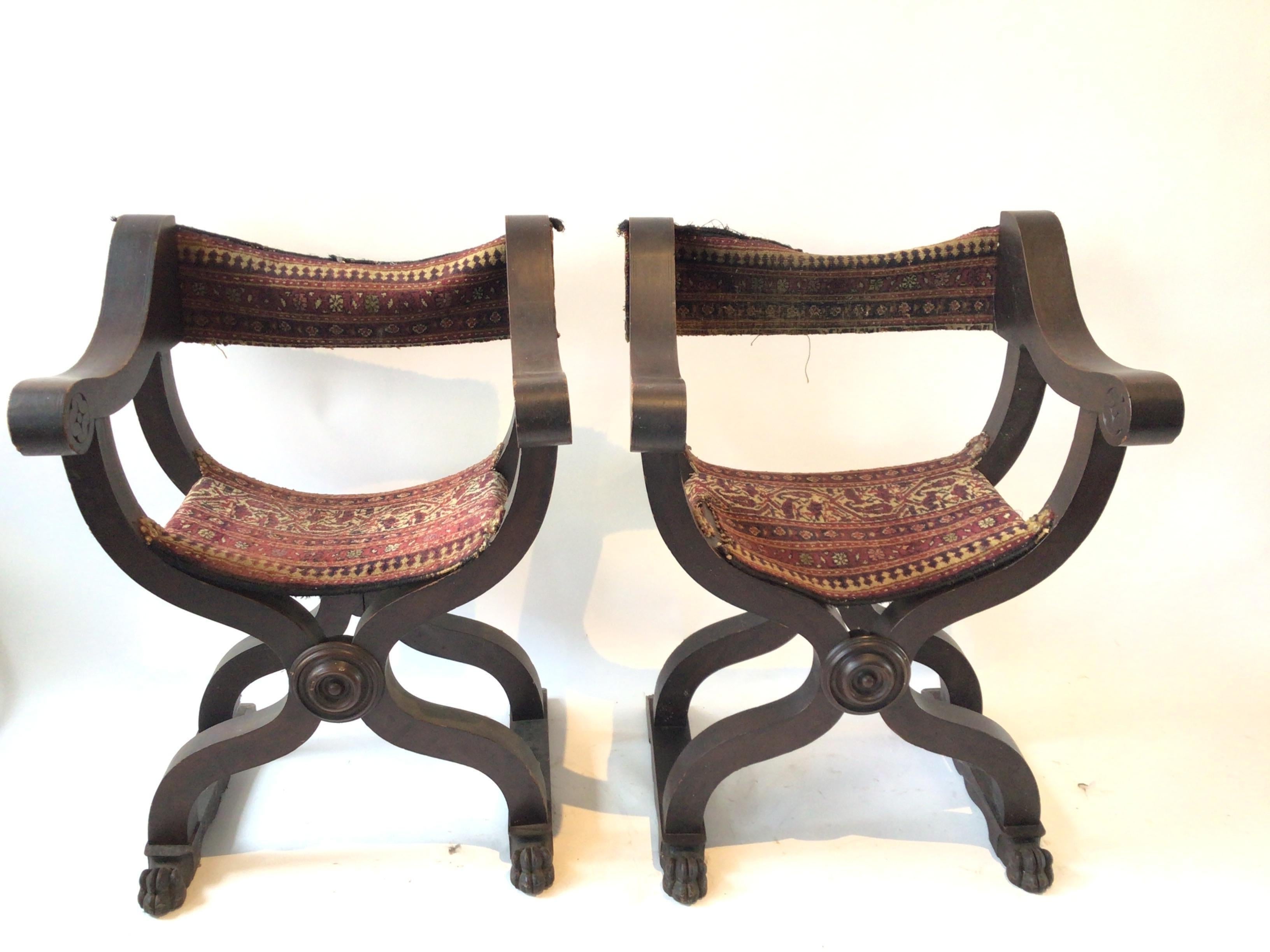 Pair of 1920s Savonarola chairs in carved wood frames with lion paws. Needs reupholstering.