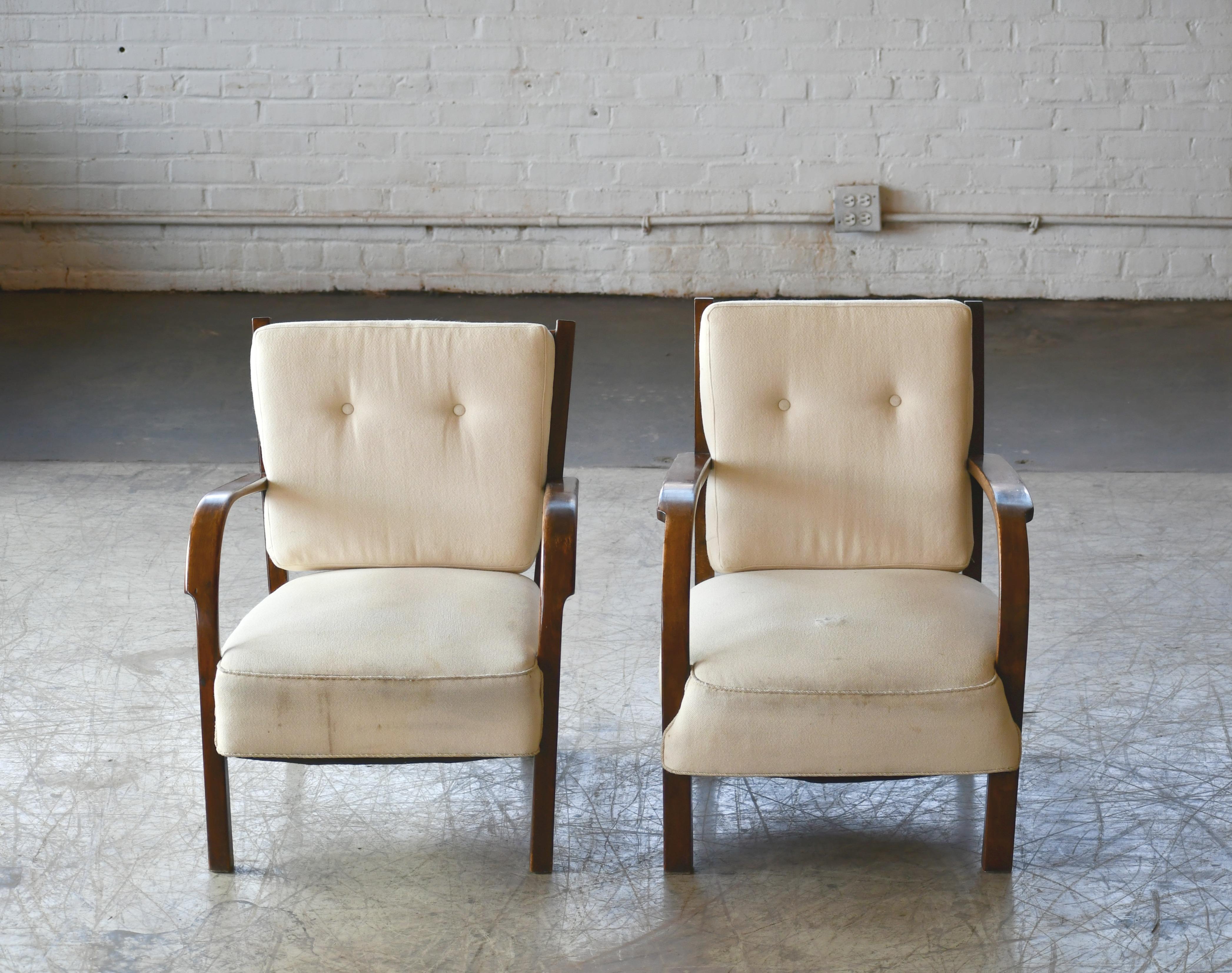Very elegant late Art Deco pair of easy chairs by Fritz Hansen. We found these chairs in Copenhagen and did not really know much about them but just found them really attractive. They are made of Cuban mahogany which indicated that they likely are