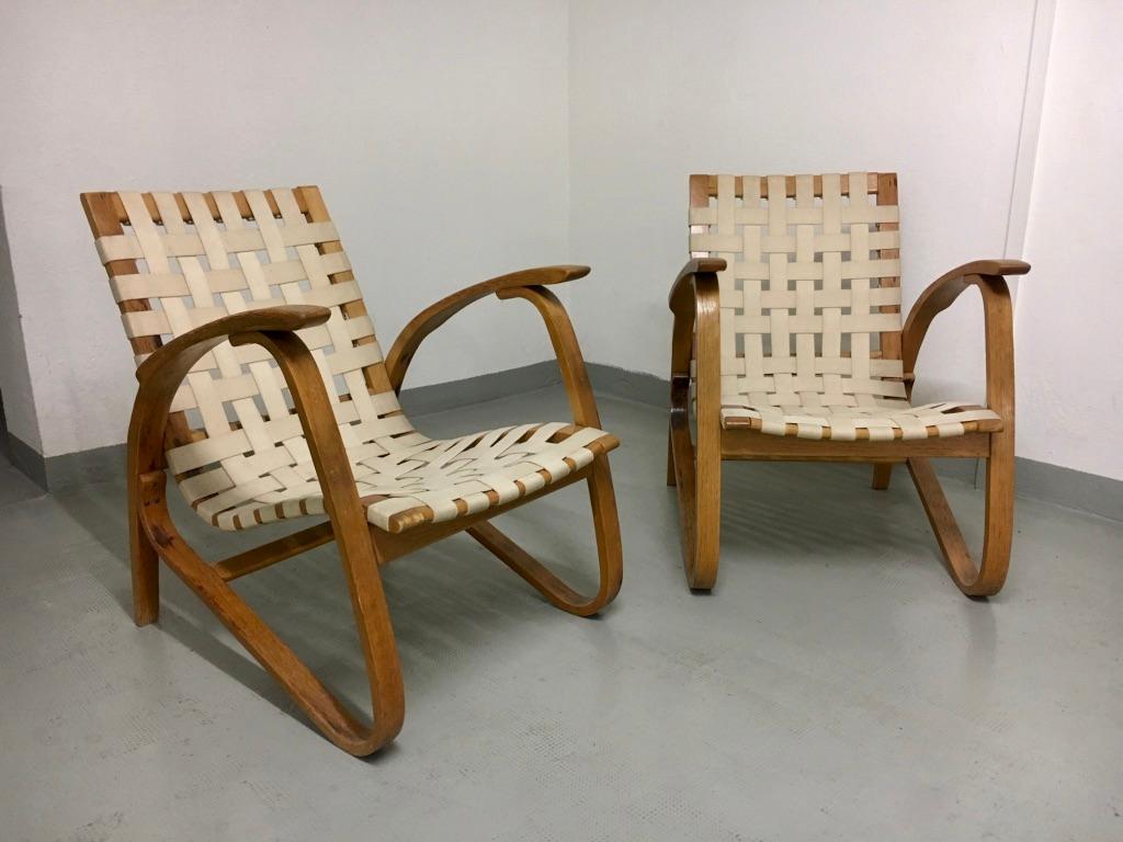 Pair of bent beechwood armchairs by Jan Vanek, produced by Spojene UP Zavody, Czech, circa 1930s.
Woven straps gives it a confortable sitting.
Good condition.
    