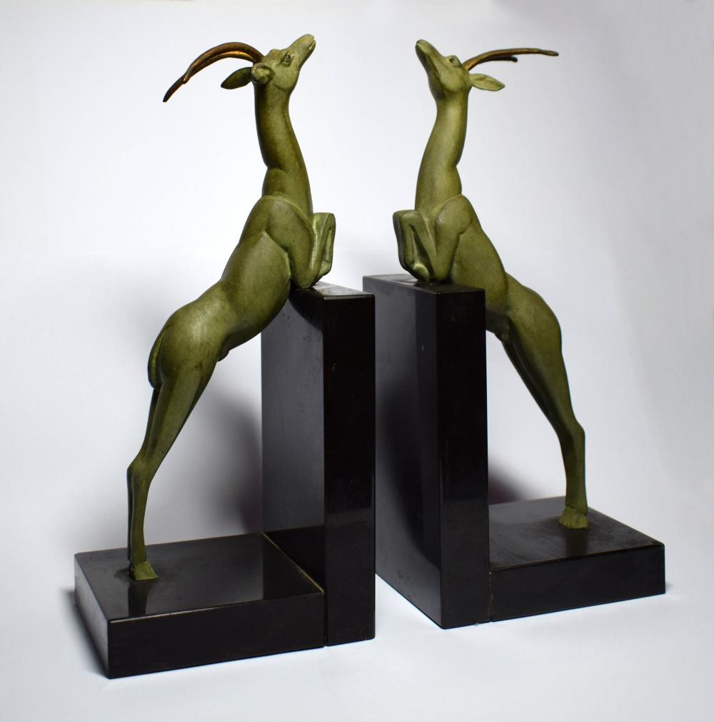 For your consideration is this very stylish pair of Art Deco bookends depicting two Antelope climbing on a wall of black marble. Originating from France, on handling these you get a real sense of quality. The green Verdigris styled patination