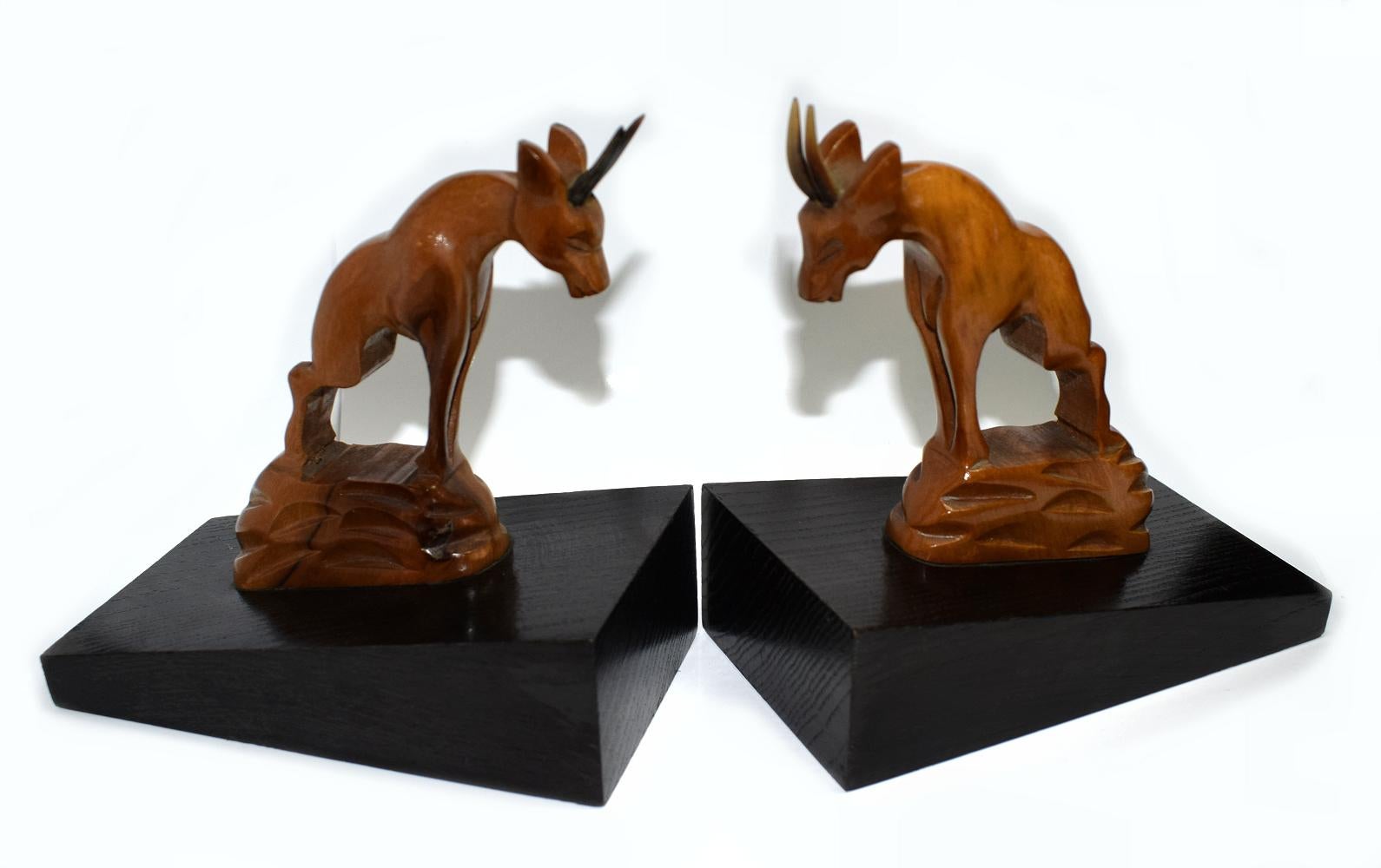 For your consideration is this very stylish pair of Art Deco bookends depicting two antelope climbing on a wall of black ebonised wood. Originating from France, these bookends are a nice size for modern day use. Condition is very good with just the
