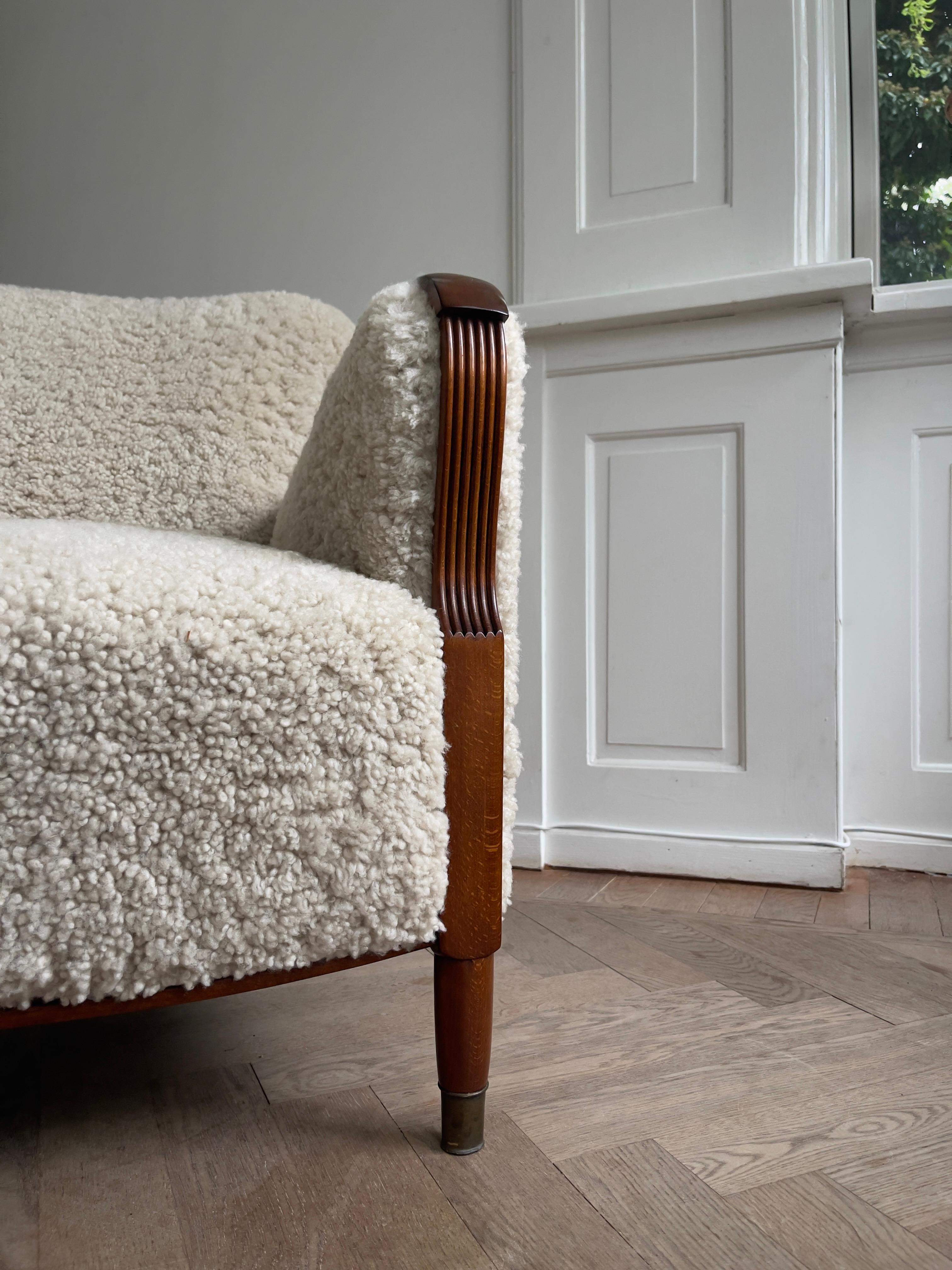 Pair of 1930s Art Deco danish lounge chairs reupholstered in natural sheepskin. For Sale 4