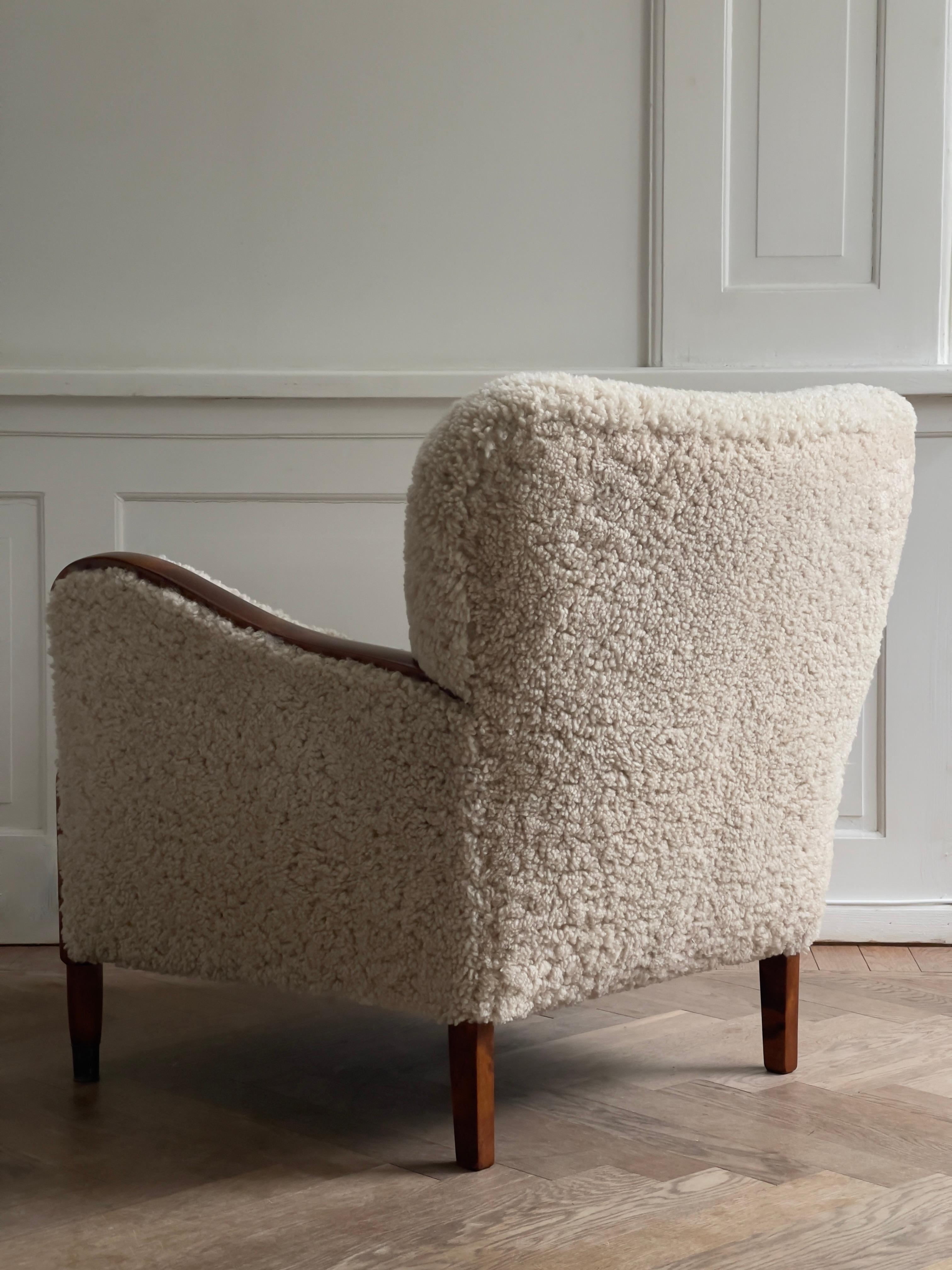 Mid-20th Century Pair of 1930s Art Deco danish lounge chairs reupholstered in natural sheepskin. For Sale