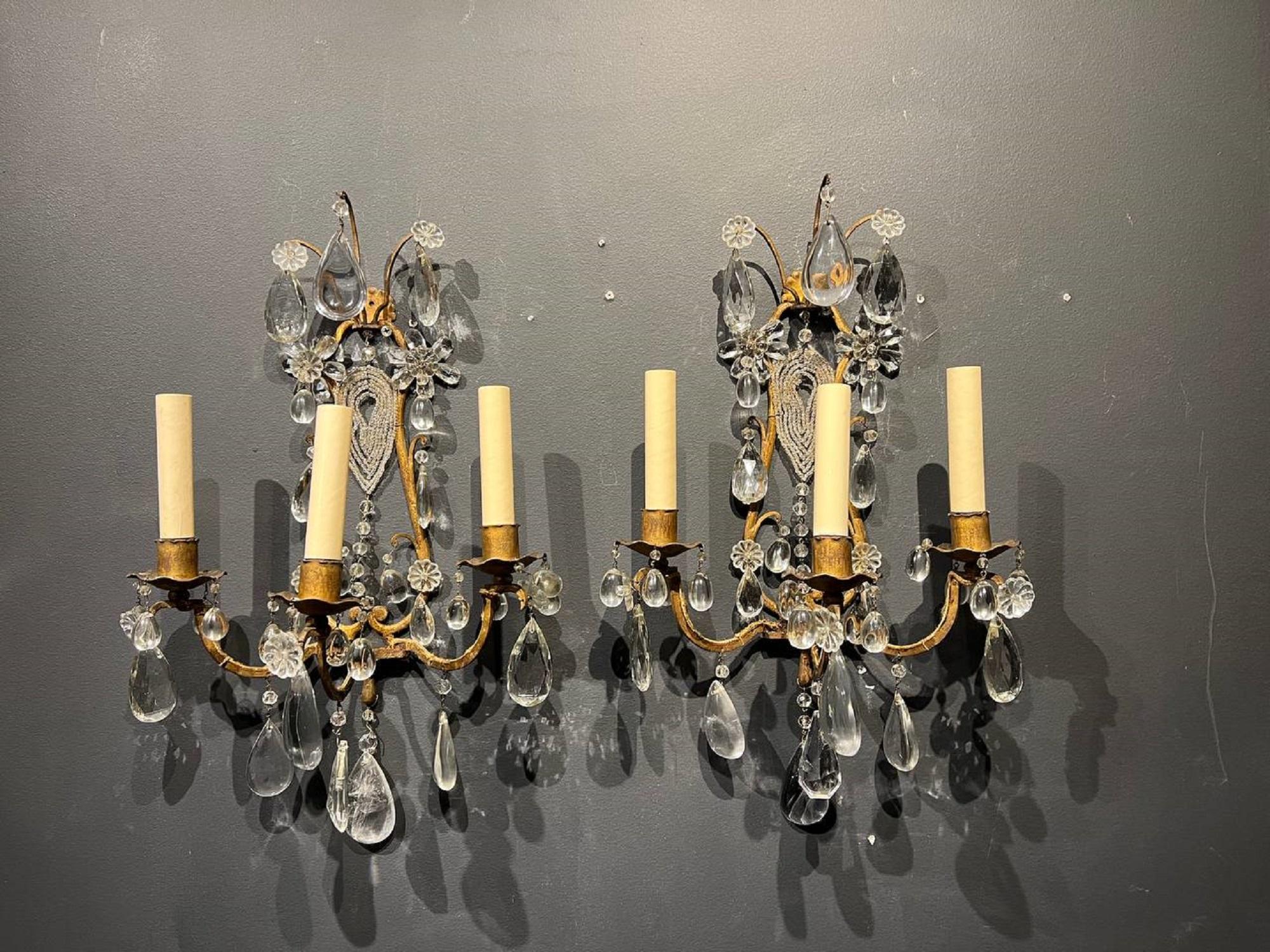 A pair of 1930’s French Bagues sconces with crystal hangings. In very good vintage condition, with original finish and patina. Newly rewired for the US. 

Color: Gold

Up to 120V (US Standard)
Hardwired

Dealer: G302YP.
 