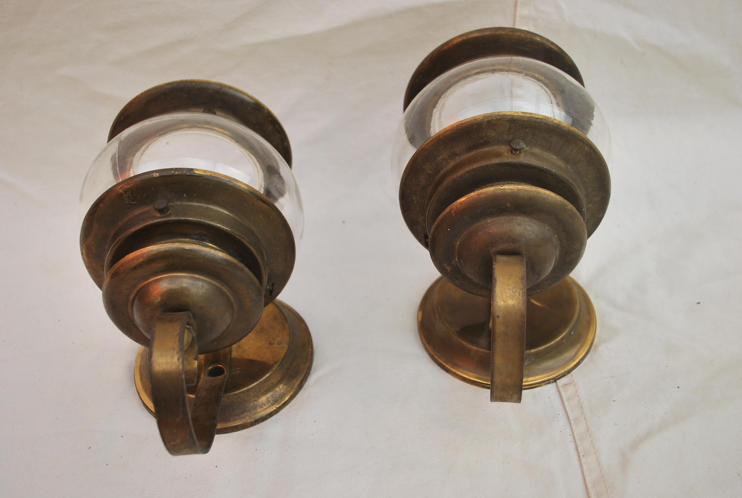 A cute little pair of 1930s brass outdoor sconces, or indoor as well, I could see these in a small bungalow style house or beach house.