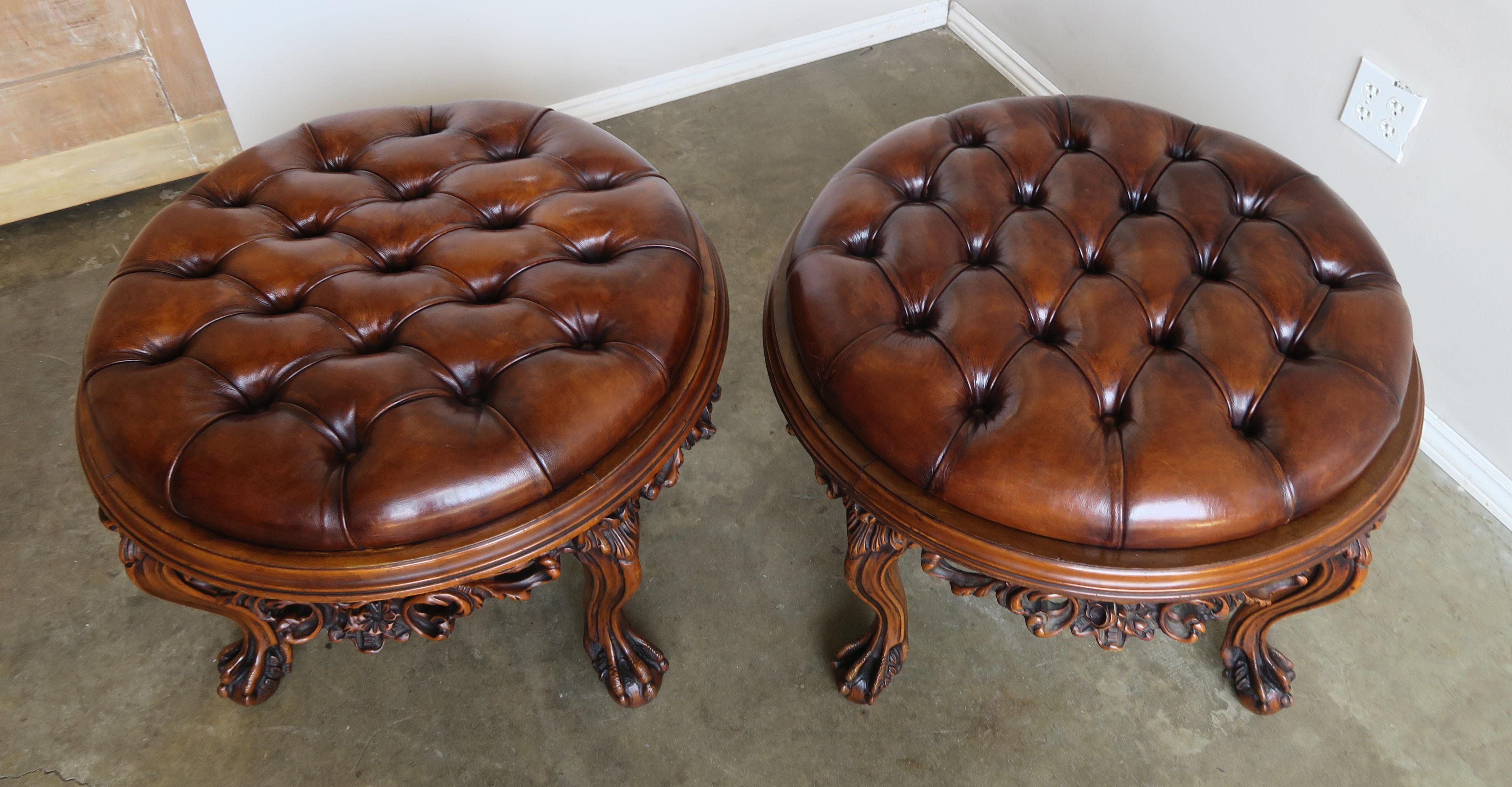 French Pair of 1930s Carved Walnut Leather Tufted Ottomans