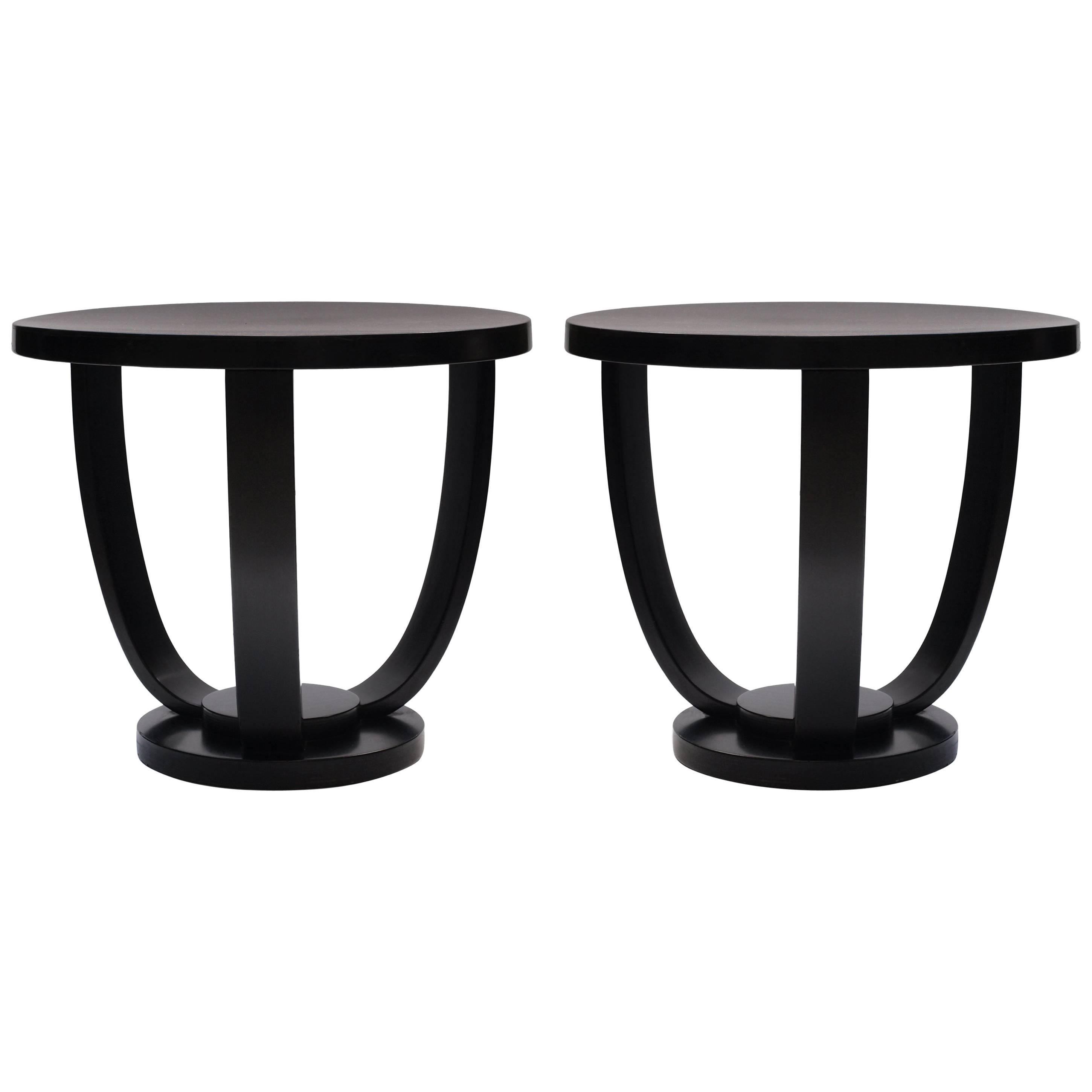 A pair of 1930s black circular bent wood side tables made by Fischel. The three bent wood supports curve up from the sturdy circular base. The wood is finished in a black satin paint. Marked ‘Fischel, Import de Tchecoslovaquie’ with the original