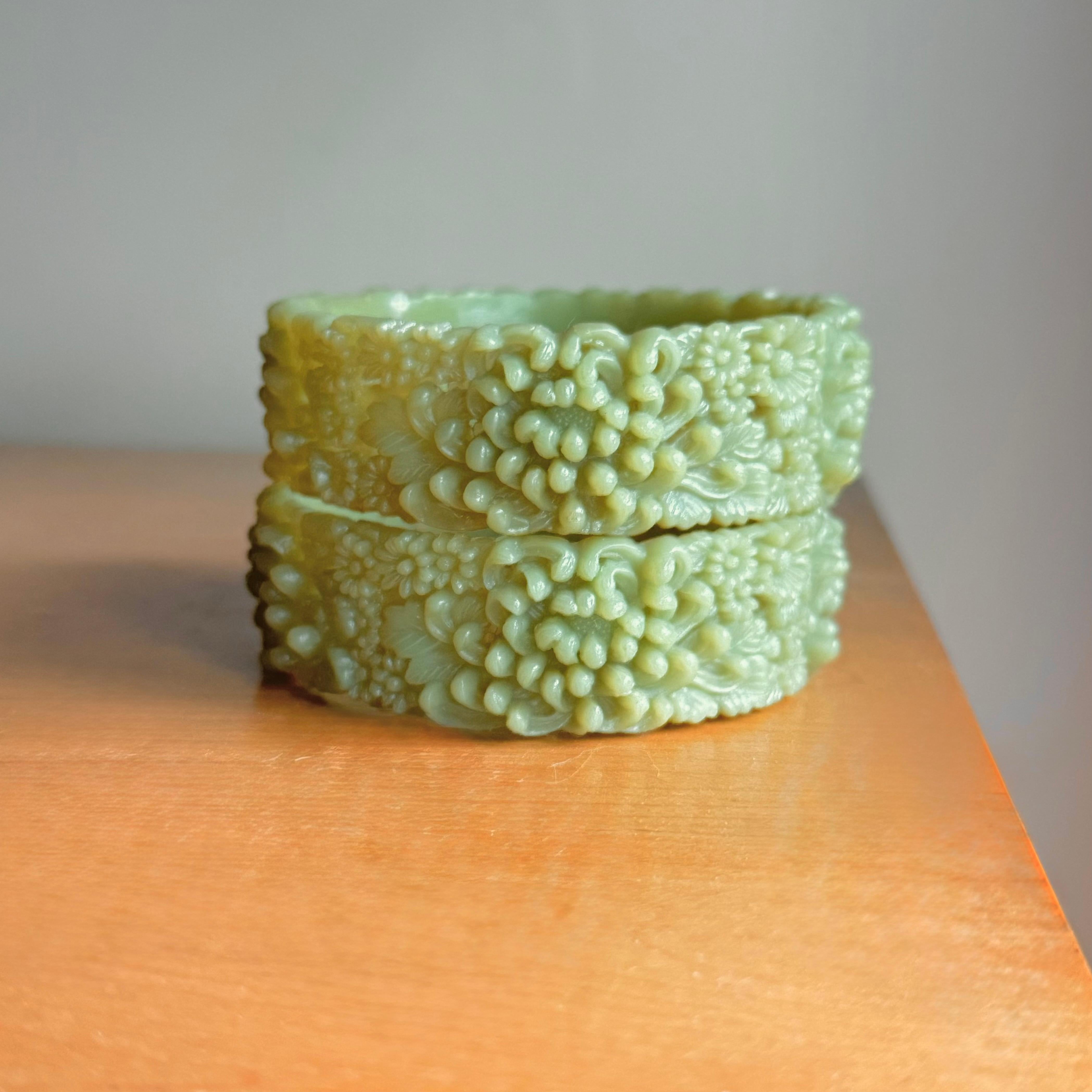 Pair of 1930’s Crythansium Bangles, Pierced & Molded. Incredible muted green color that changes with lighting. Beautiful Semi-translucent, they have a lovely soft glow and golden green hue.
Matching pair, one is signed Japan
8&1/4” inner