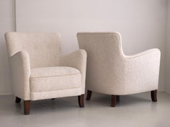 Pair of 1930s danish cabinet maker lounge chairs reupholstered in Kvadrat bouclé