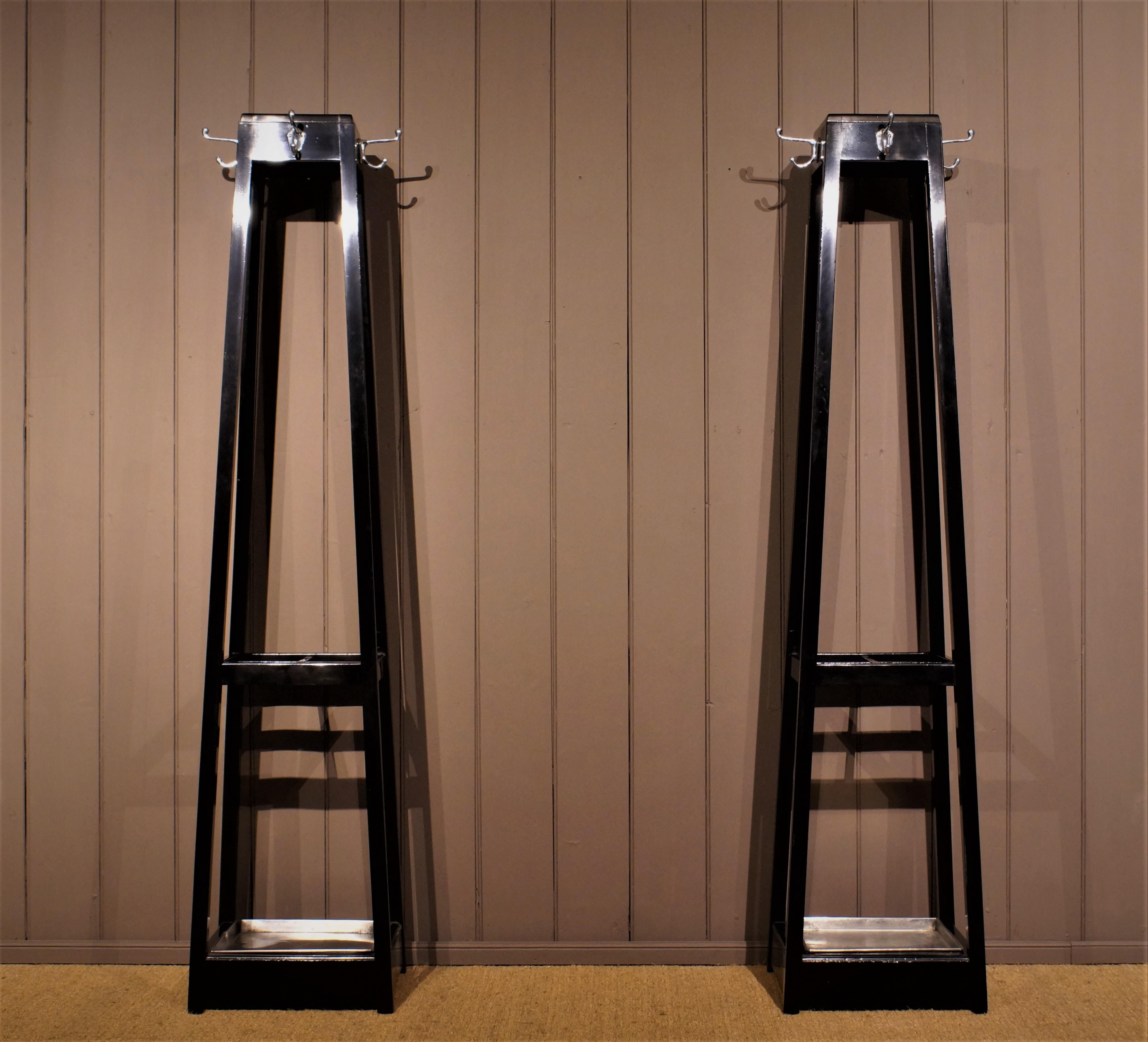 Of pyramidal, pylon or rig form these sleek and elegant stands have chrome hooks and four sections for sticks and umbrellas.
Incredibly stylish this rare pair retain their original metal trays.