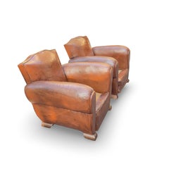 Paire de fauteuils de club français Art déco en cuir cognac des années 1930