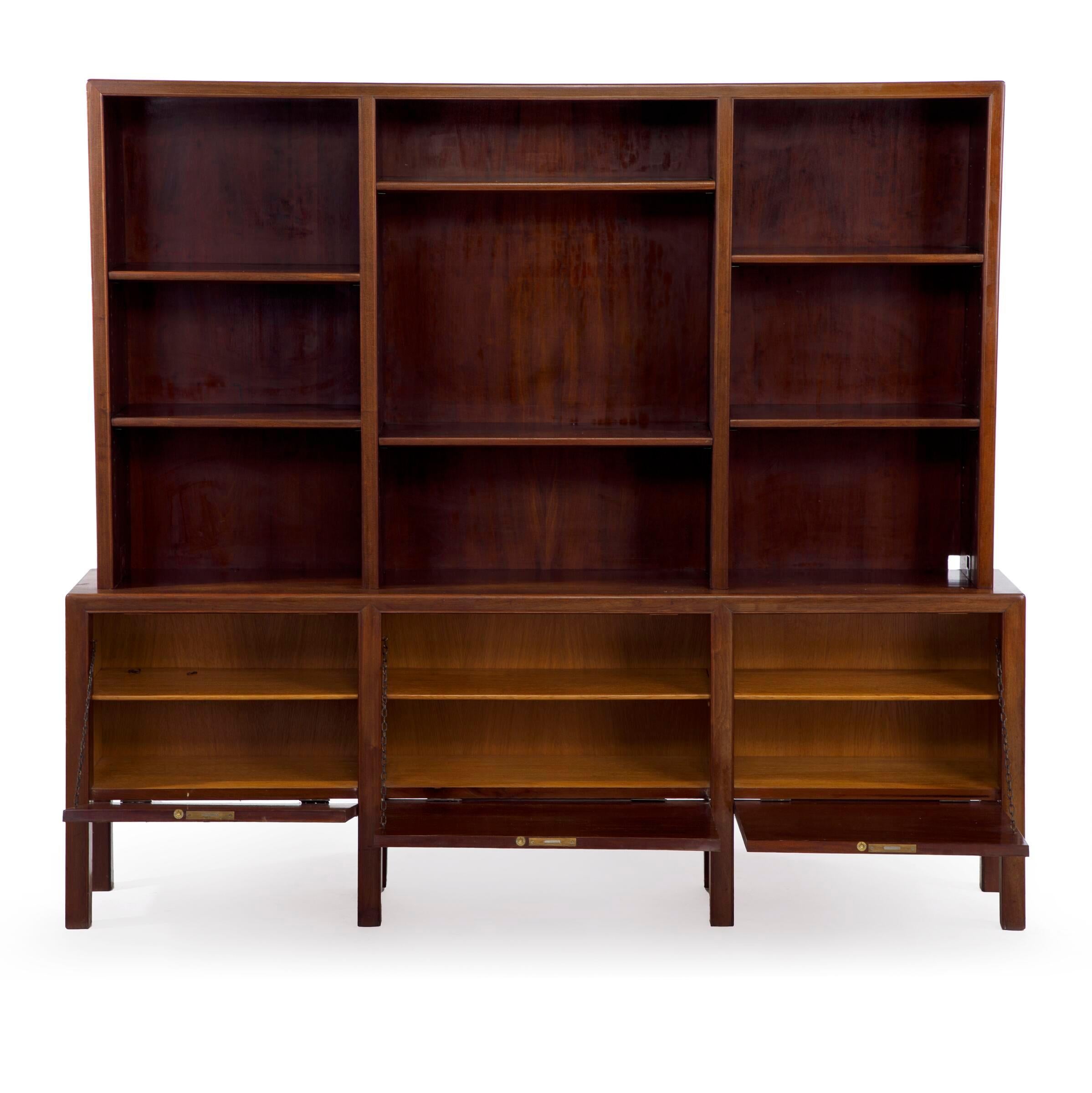 Pair of 1930s Frits Henningsen cuban mahogany wall units with profiled edges and with three cabinets. Numbered 4504. Refinished. One back with cutted hole.
