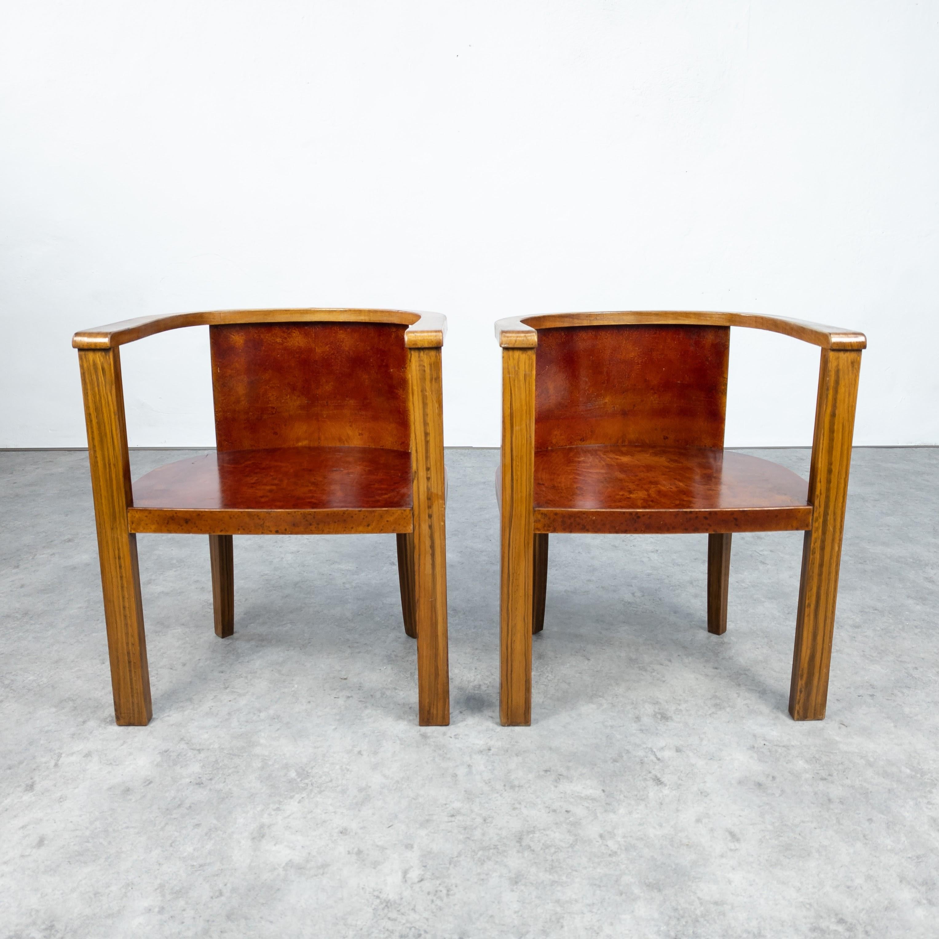 Pair of beautiful wooden barrel chairs manufactured in Germany in 1930's. Made of solid beech and walnut veneer. In very good original condition with beautiful patina. Structurally sound. Wood expertly cleaned. Measures: Height 70 cm, seat height 40