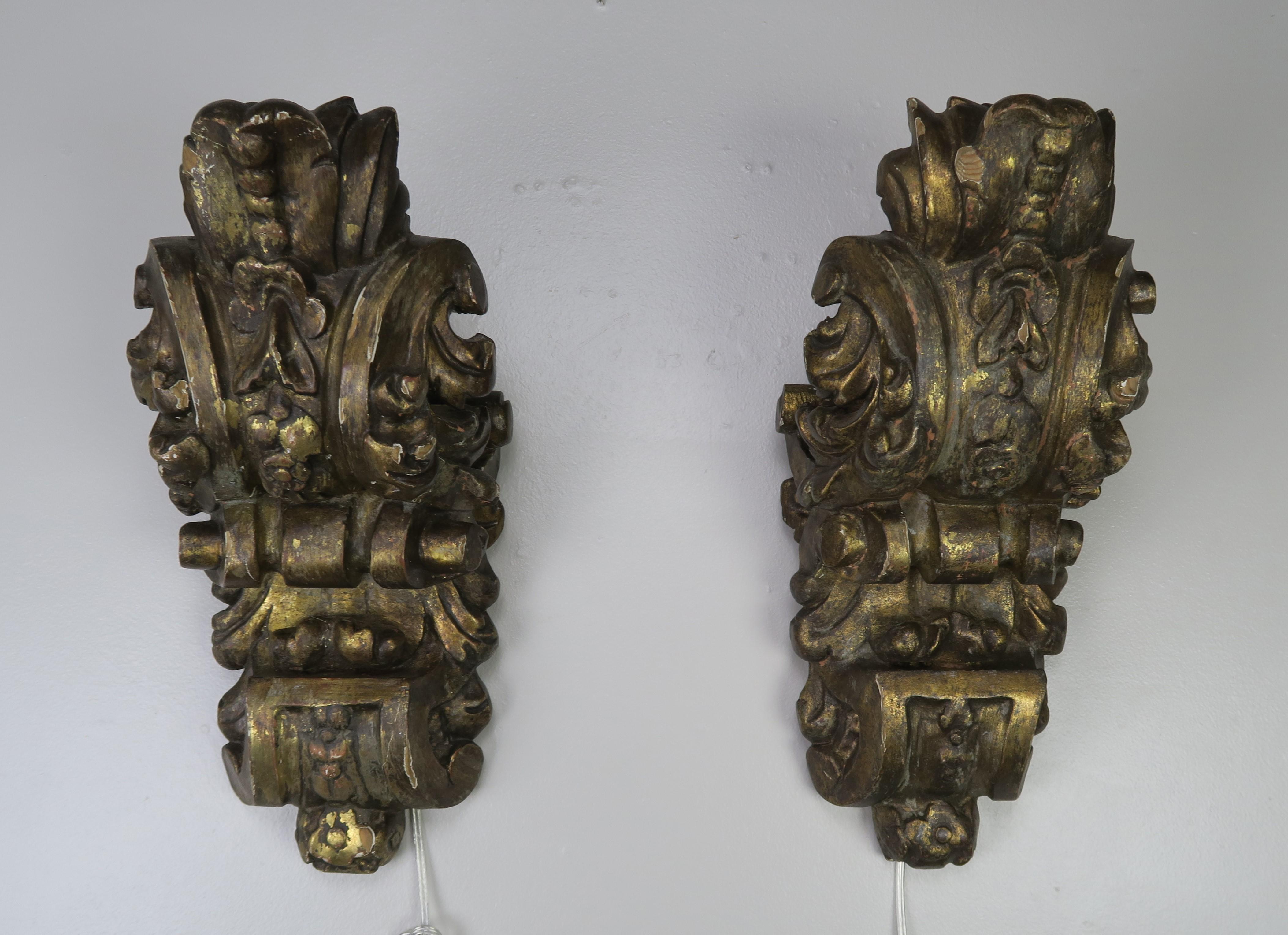 Pair of carved giltwood architectural corbels that have been wired into sconces and ready to install. Beautiful carved details including scrolled acanthus leaves and flowers throughout.
  