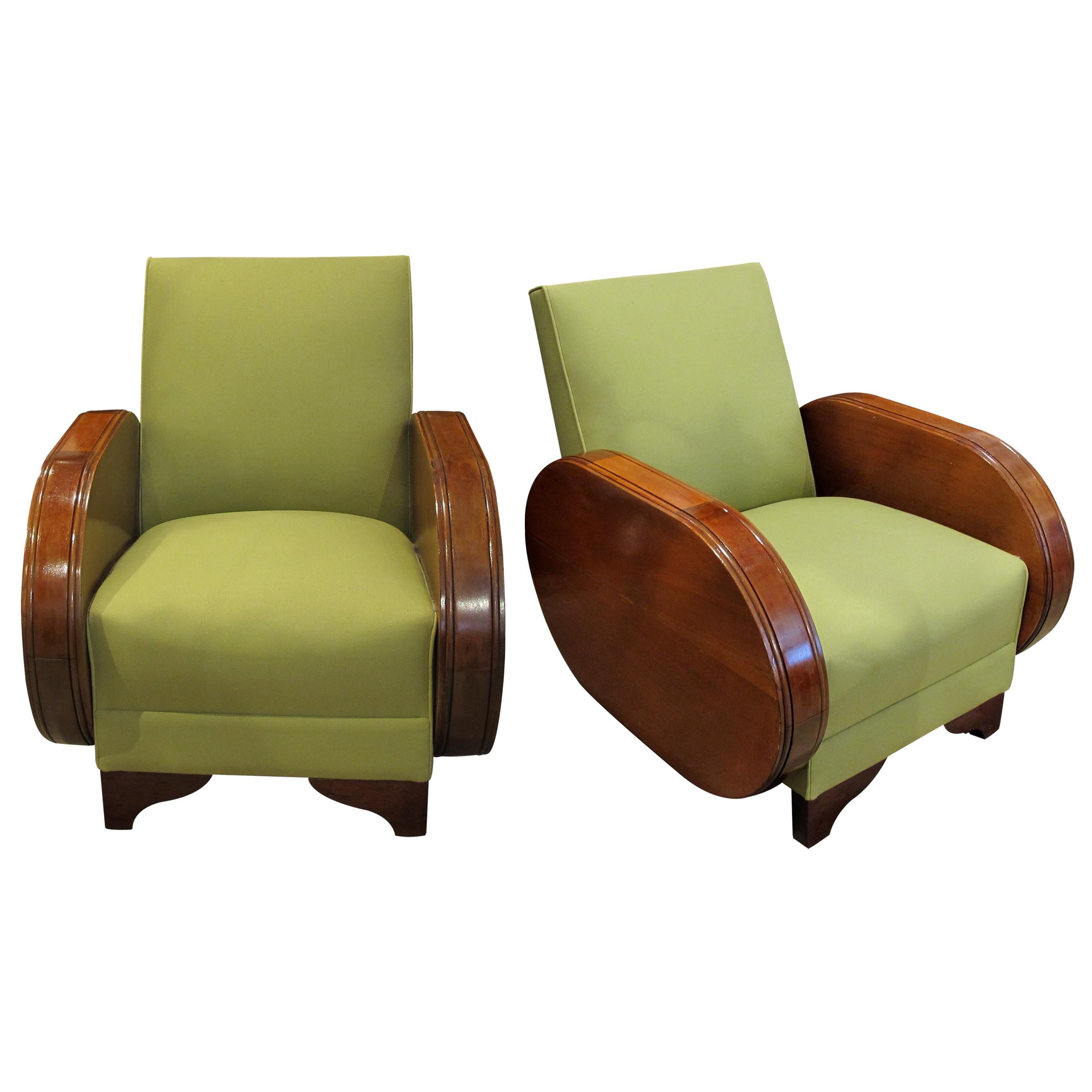 A pair of stylish and comfortable 1930s Art Deco Walnut armchairs with beautiful curved armrests and solid backrests upholstered in a lime green fabric. You may wish to reupholster them based on your own personal taste and requirements but the