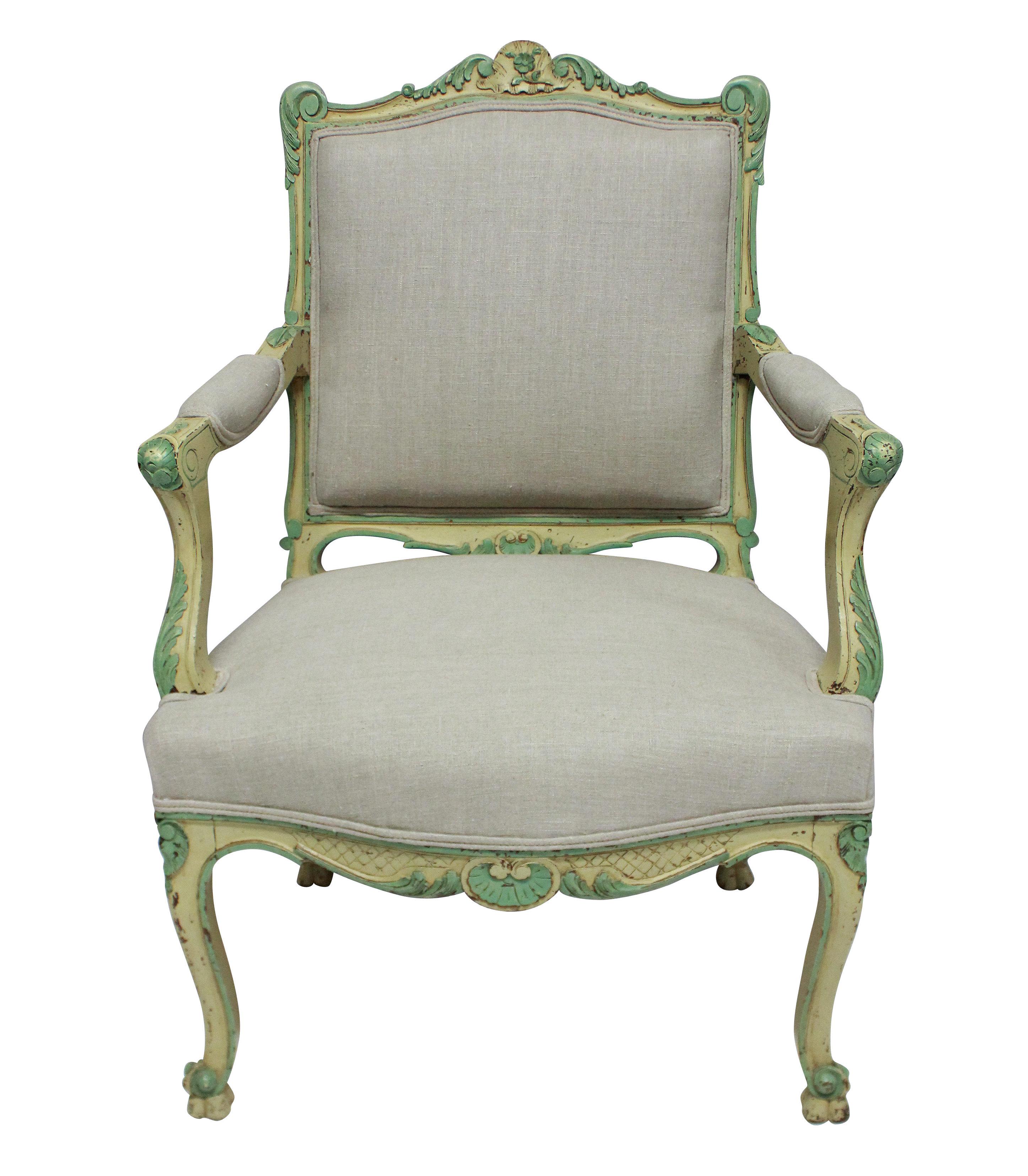 A pair of French Louis XV style walnut armchairs of generous scale, in pale yellow and green paints. Newly upholstered in raw linen.
