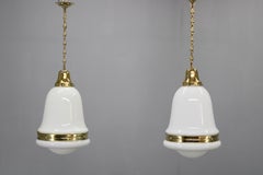 Pair of 1930s Peter Behrens Luzette Pendants in Opaline Glass and Brass