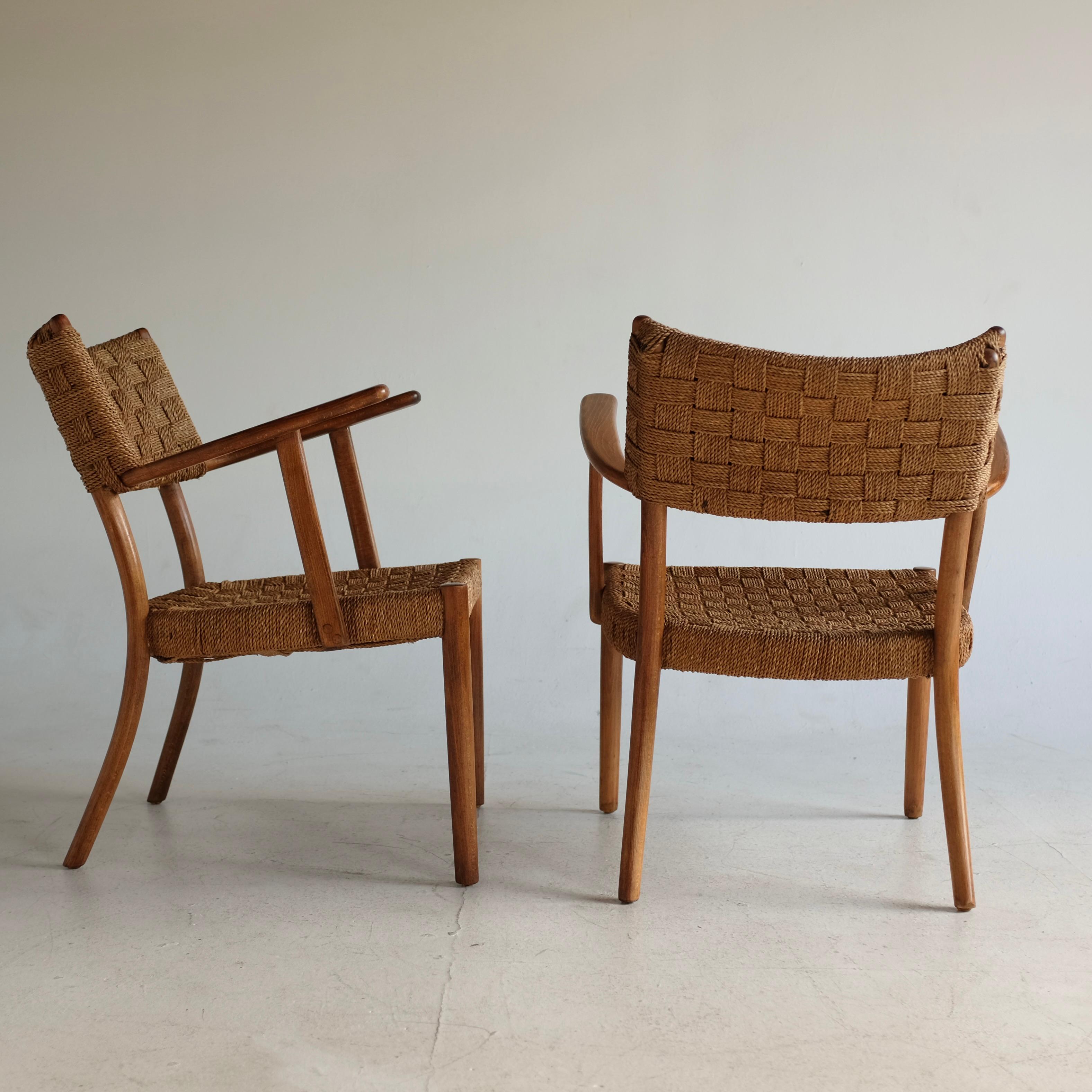 Beatiful pair of 1930's Rope chair Model 1570 by Karl Schrøder for Fritz Hansen. Beautiful woven papercord on the back and seat with beech frame. The frame has been restored and the cord is in very good condition with a couple of wear and tear from