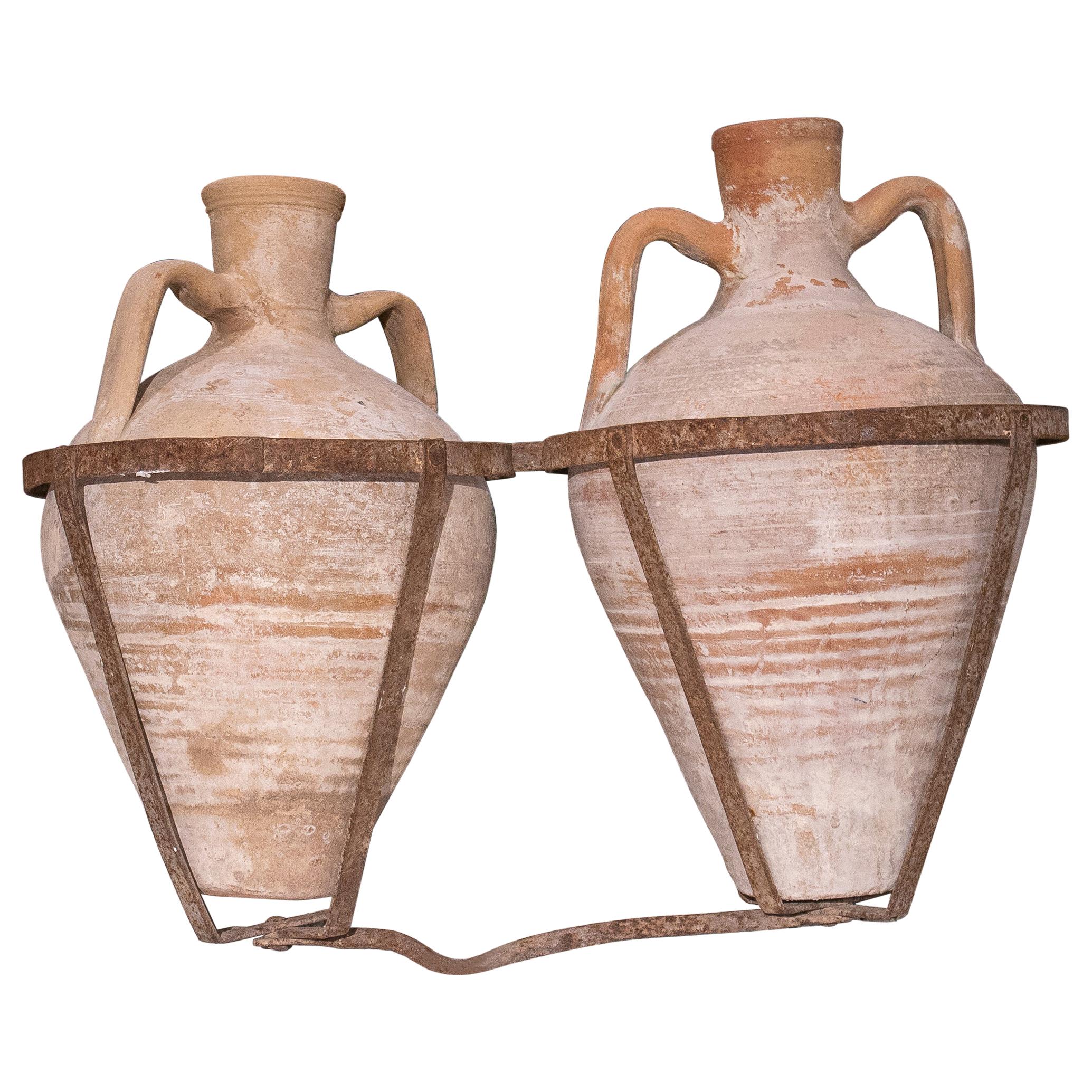 Pair of 1930s Spanish Terracotta Vases w/ Iron Basket to be Carried by Mules
