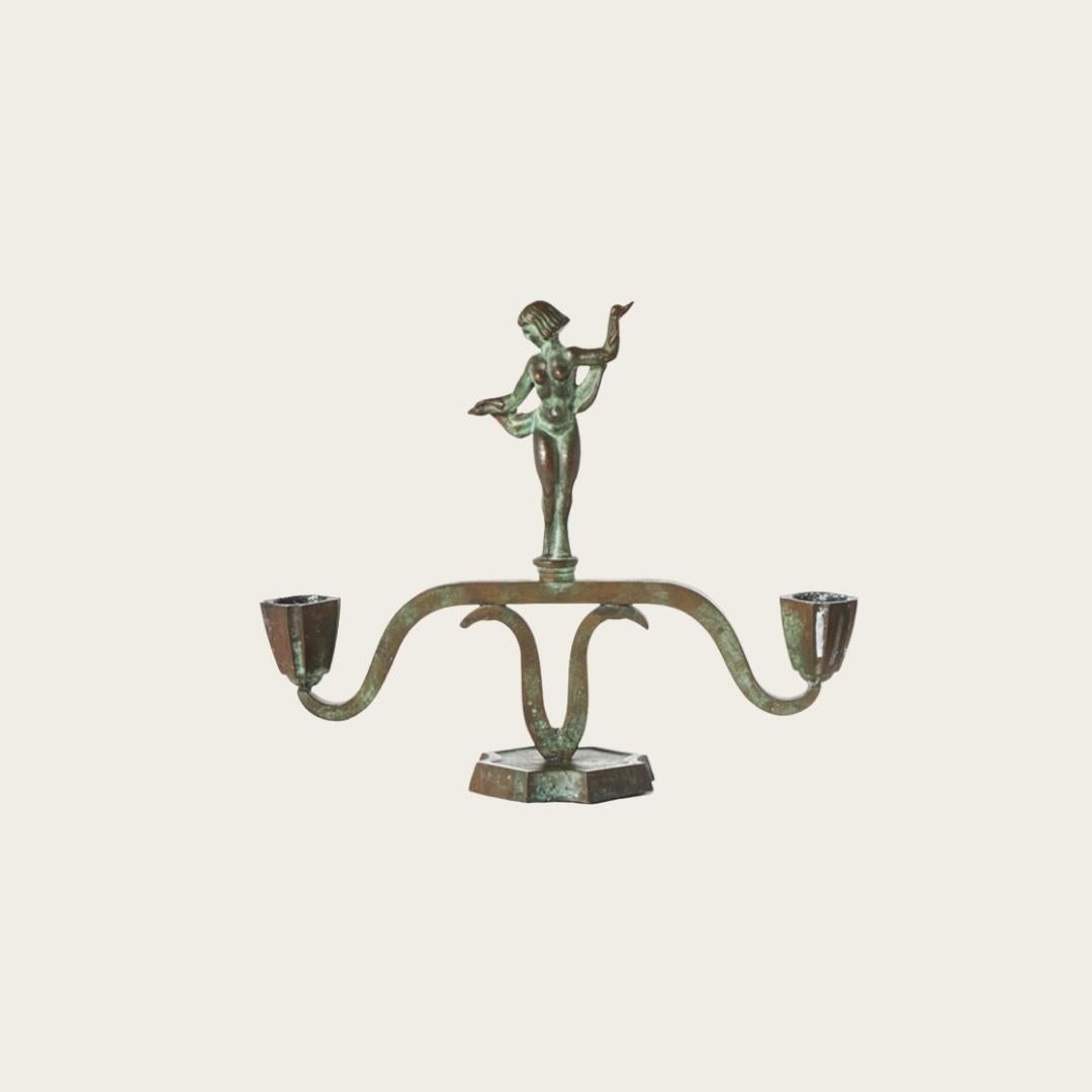 1930s, Sweden. Patinated Bronze with octagonal bases, curved frames and Statuesque figures with decorated front and backsides.

Priced and sold a pair