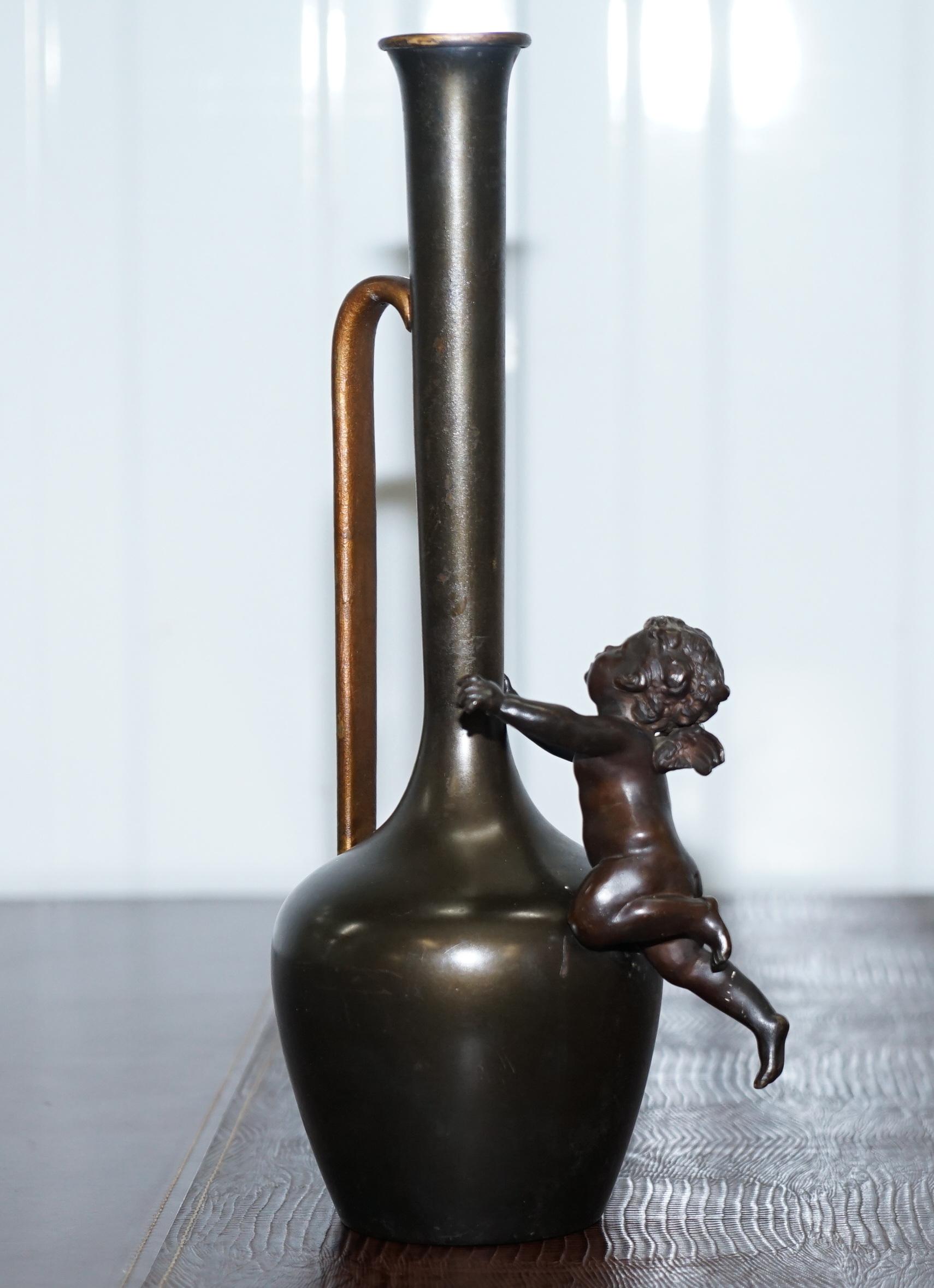 Hand-Crafted Pair of 1930s Vintage Bronze Jug Vase Urns with Little Cherub Angles Nice Find For Sale