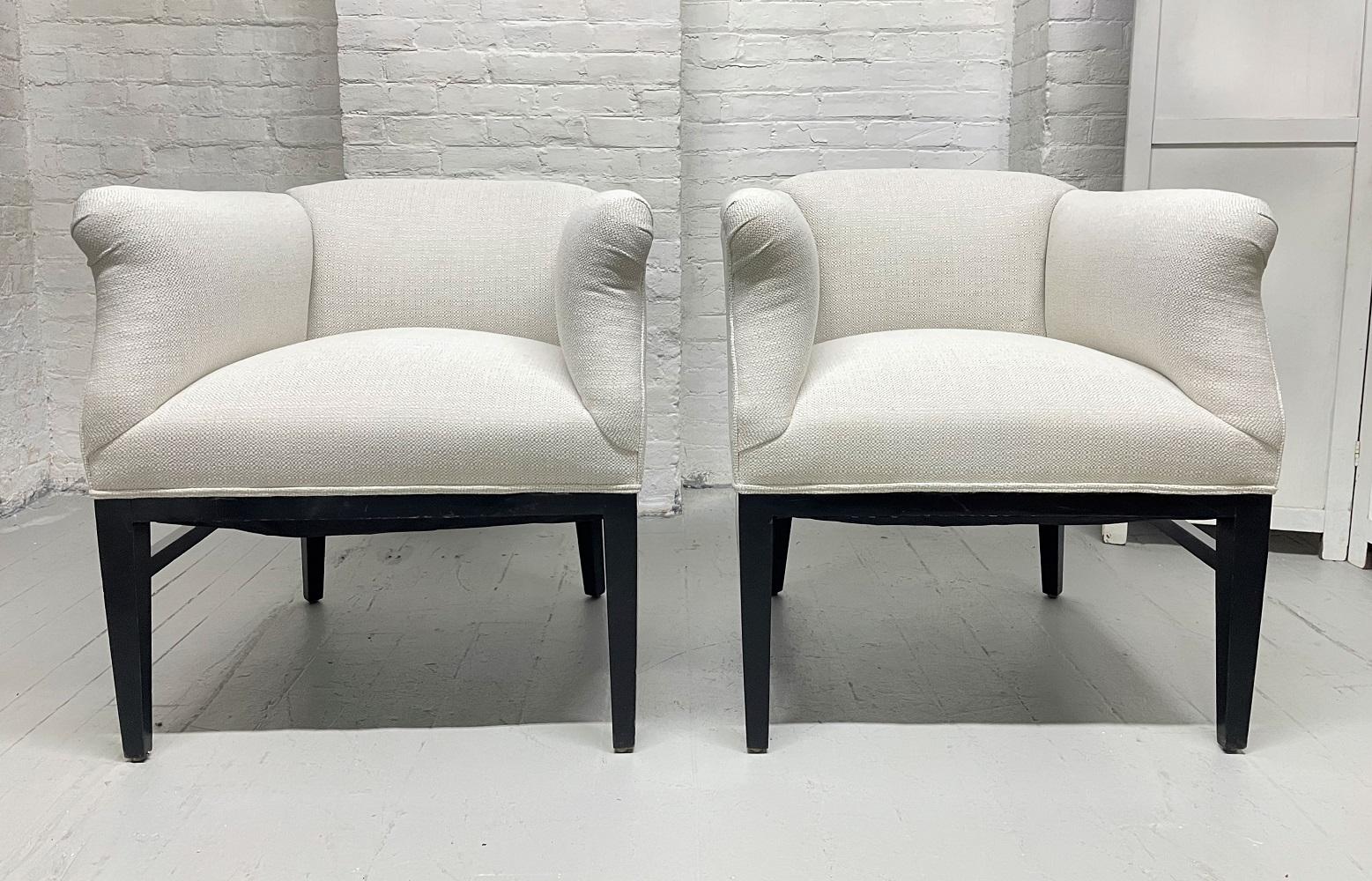 Pair of 1940s Art Deco lounge chairs. Newly upholstered with a black lacquered wood frame.