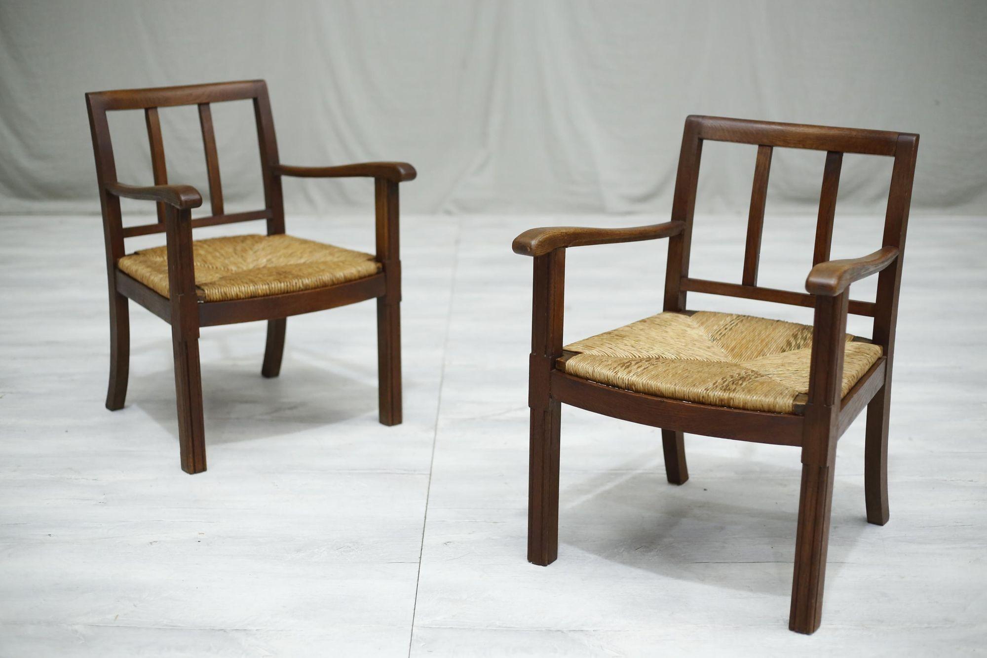 These are a very stylish pair of 1940's brutalist rush seated lounge chairs.

They have a heavy frame which I believe is made from oak and has a stunning patination to it.

Great quality overall and solid construction so you can use daily but even
