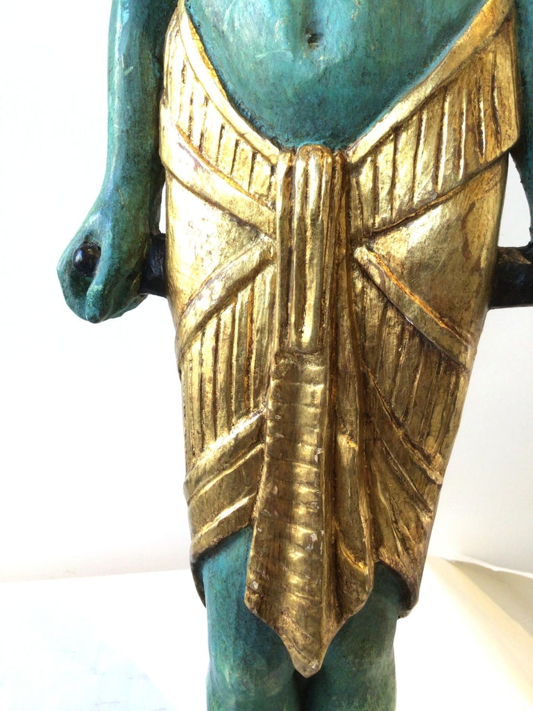 Pair Of 1940s Carved Gilt Wood Male And Female Egyptian Figures For